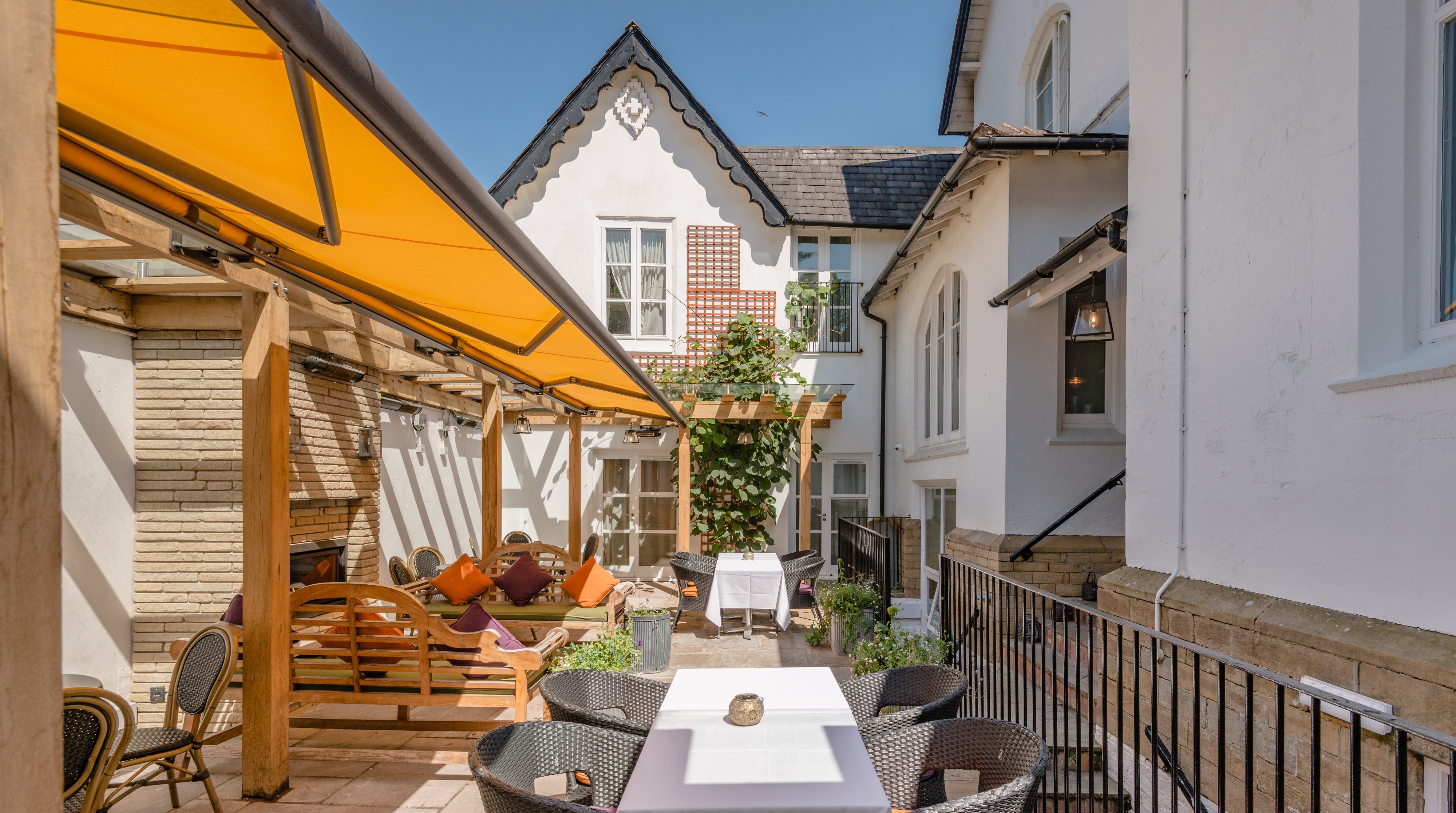 Blue Lounge at Didsbury House Hotel, vibrant outdoor event space for networking receptions.