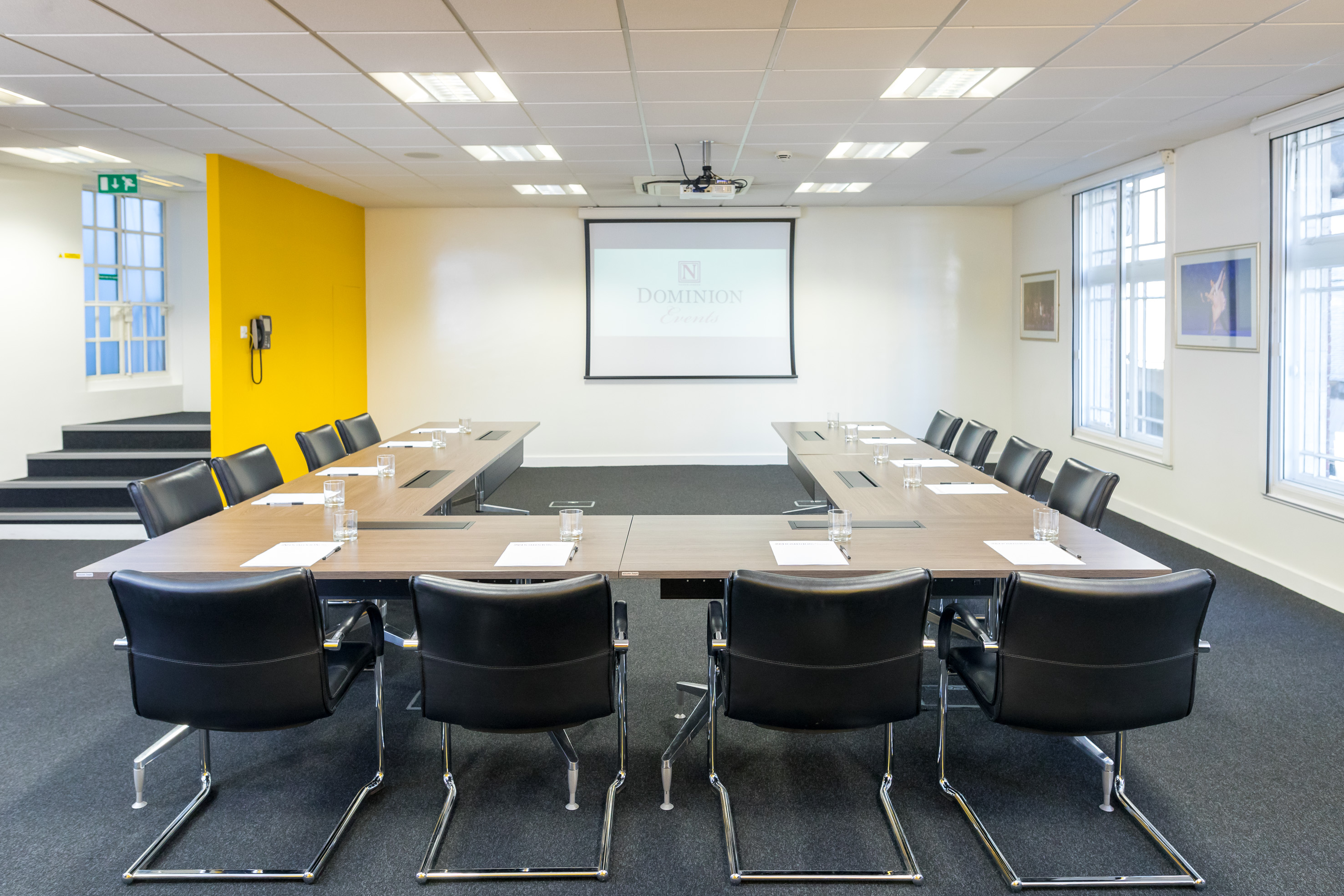 Boardroom at Dominion Theatre with central table, ideal for corporate meetings and workshops.