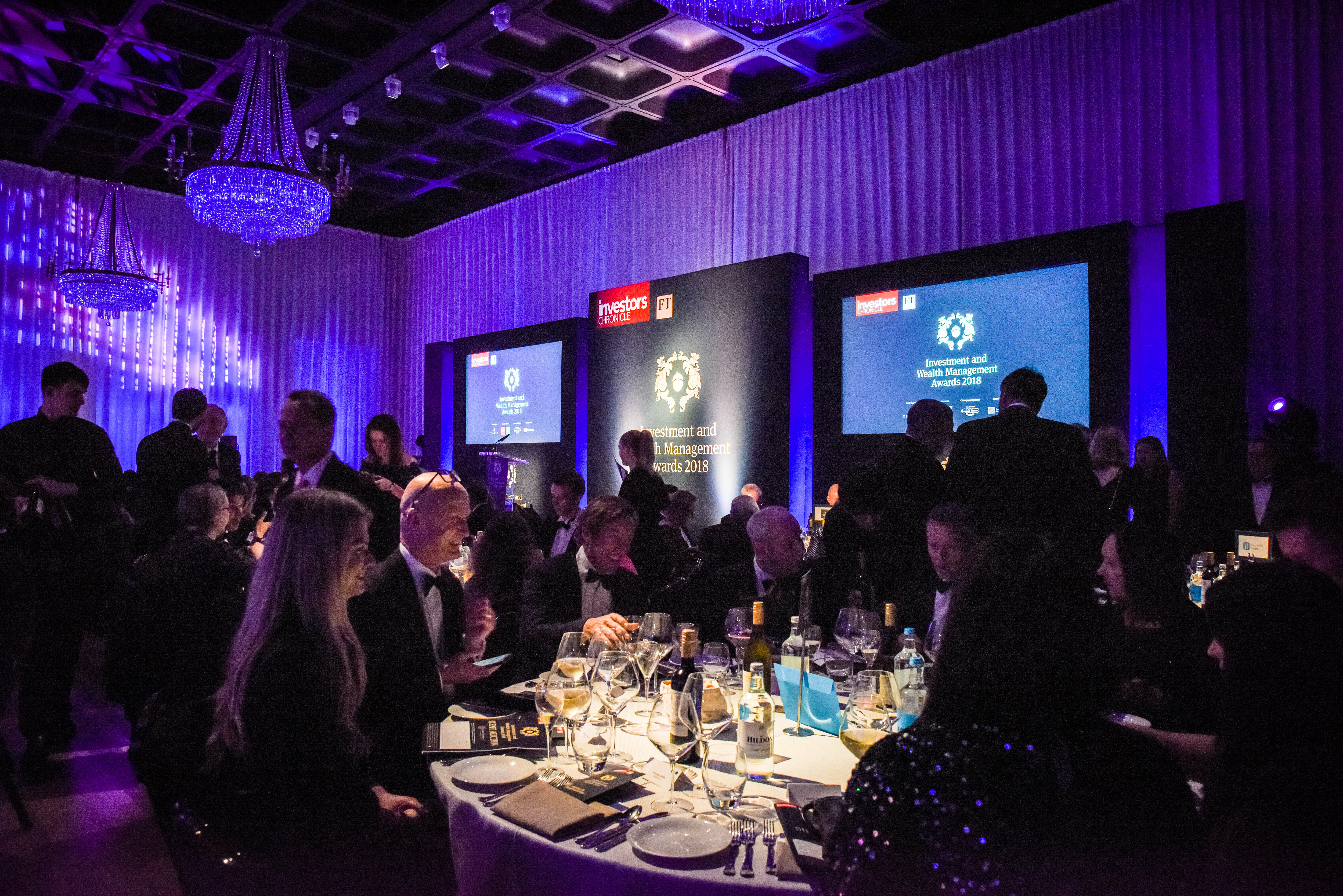 Elegant gala in Banqueting Hall, Glaziers Hall with ambient lighting and engaged audience.