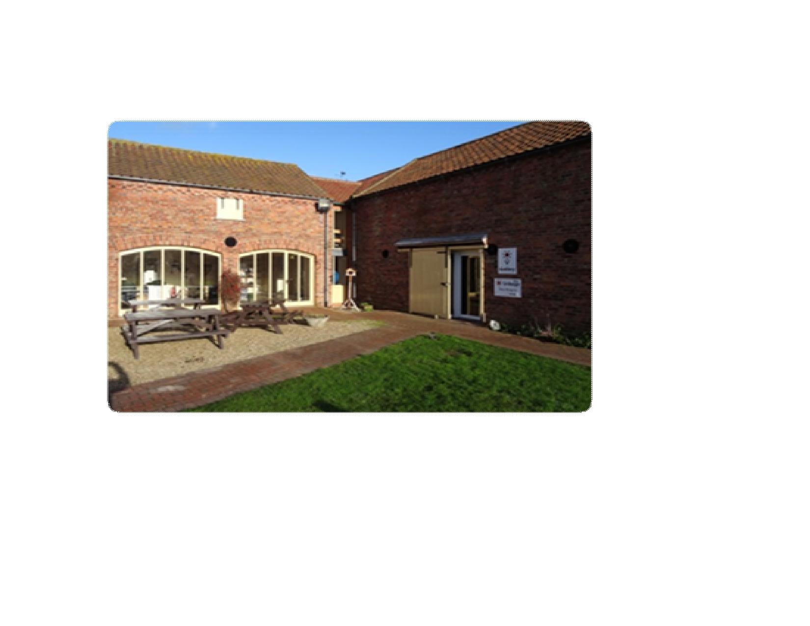Haven House Exhibition Hall: rustic brick venue for meetings and outdoor events.