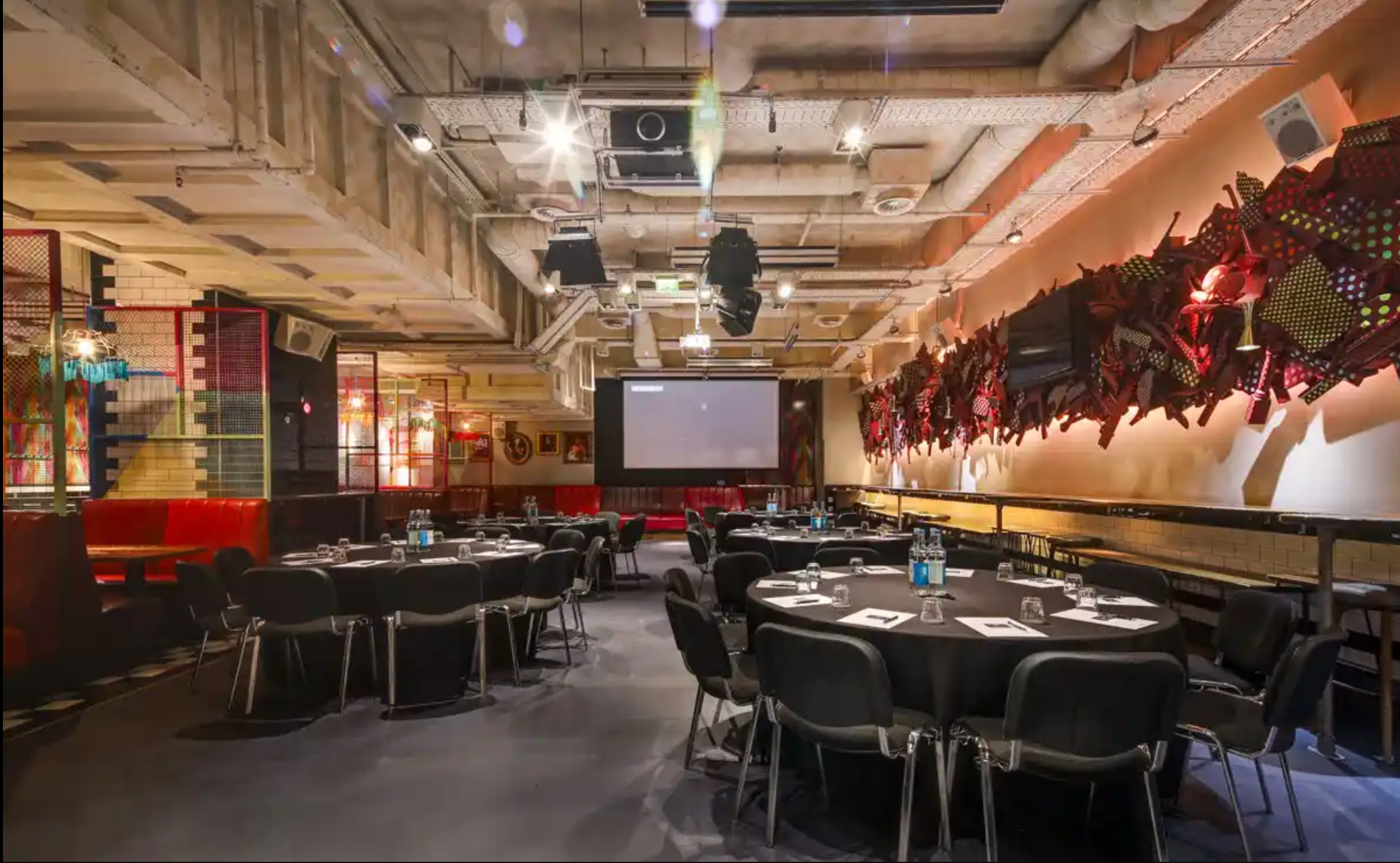Modern conference space with round tables for meetings and events at Bounce Farringdon.