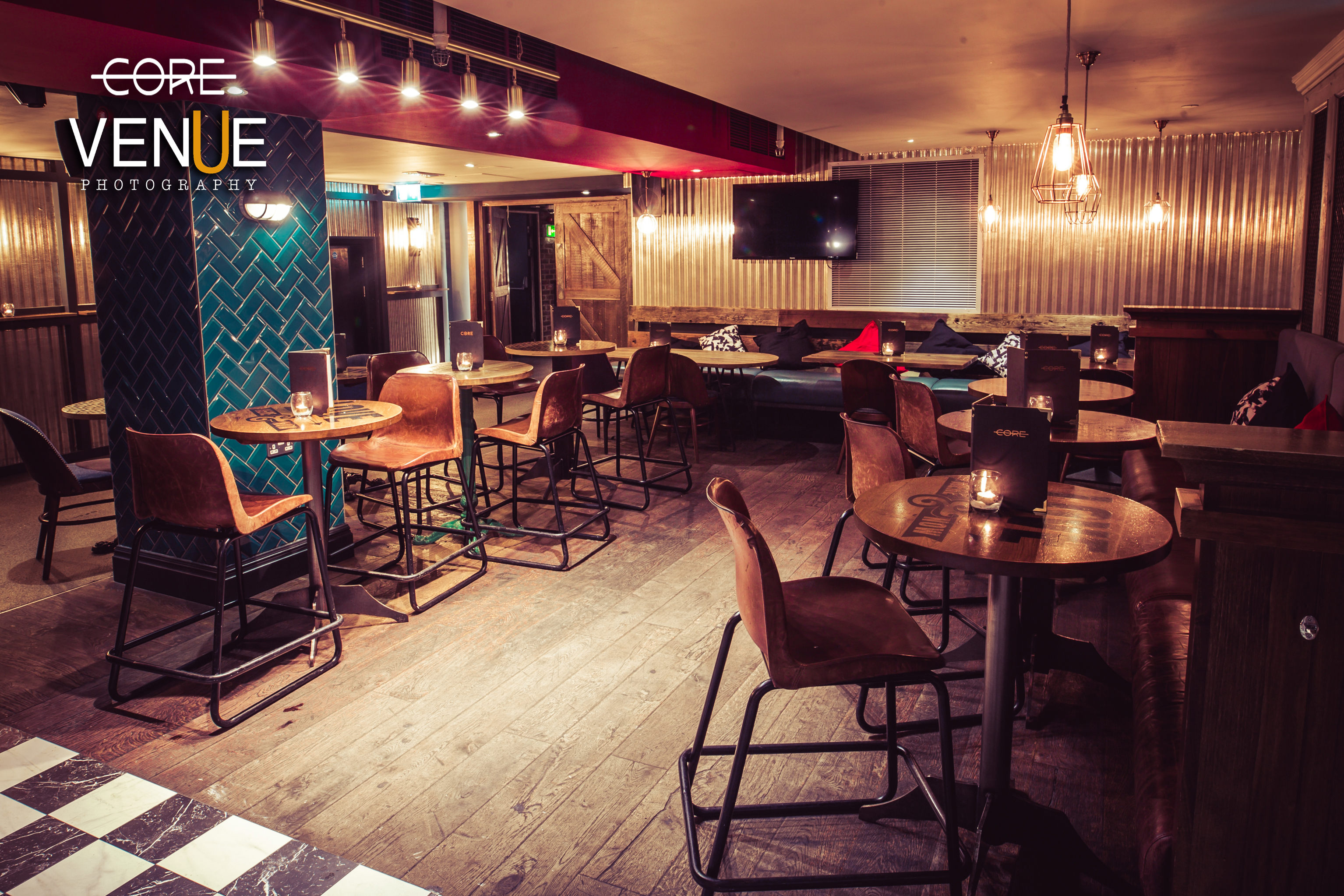 Stylish event space in Core Bar with cozy seating for networking and workshops.