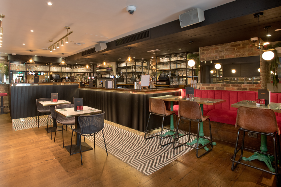 Modern dining space at Top Bar, ideal for networking events with stylish seating.