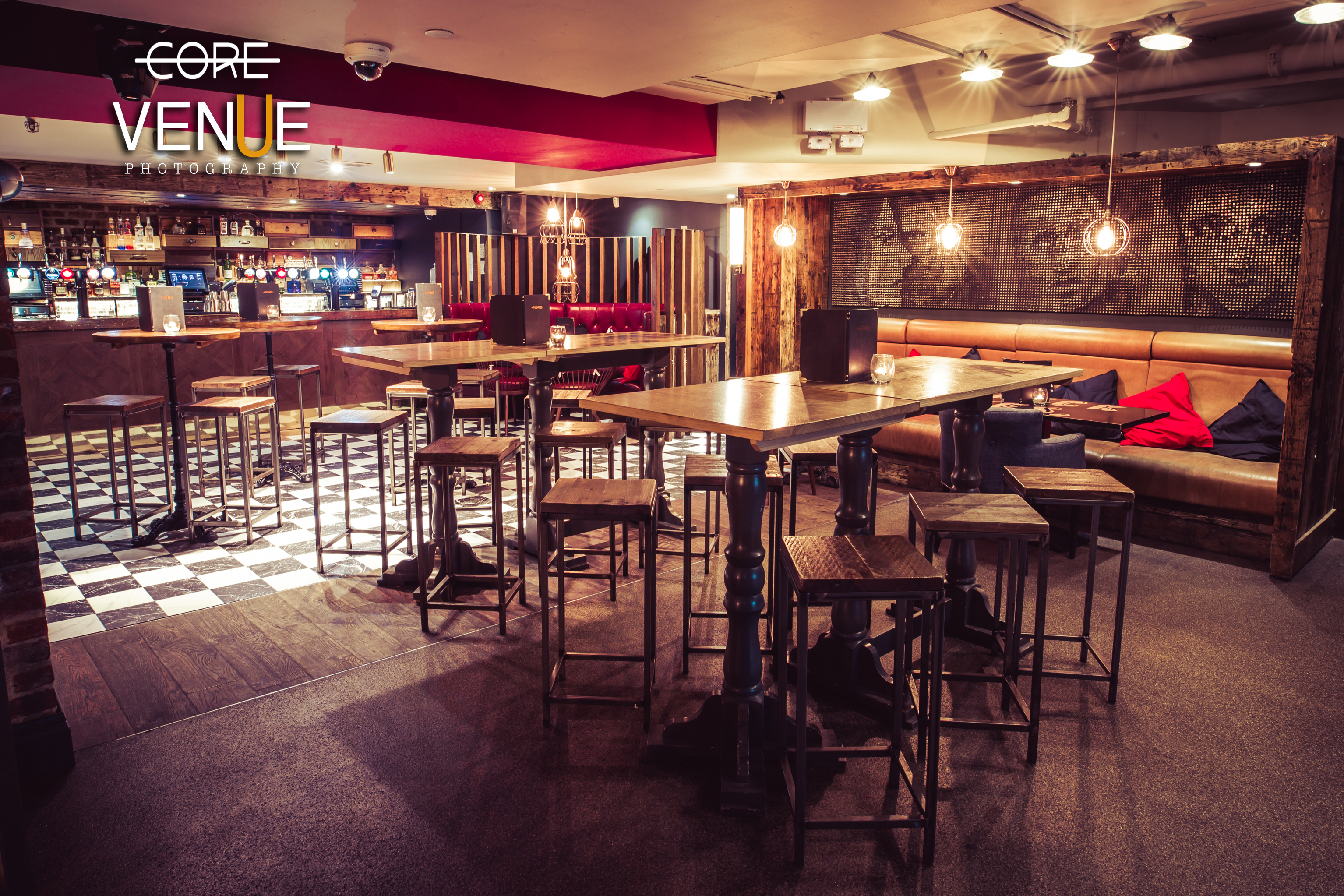 Stylish lounge with warm lighting, perfect for networking events and casual meetings.