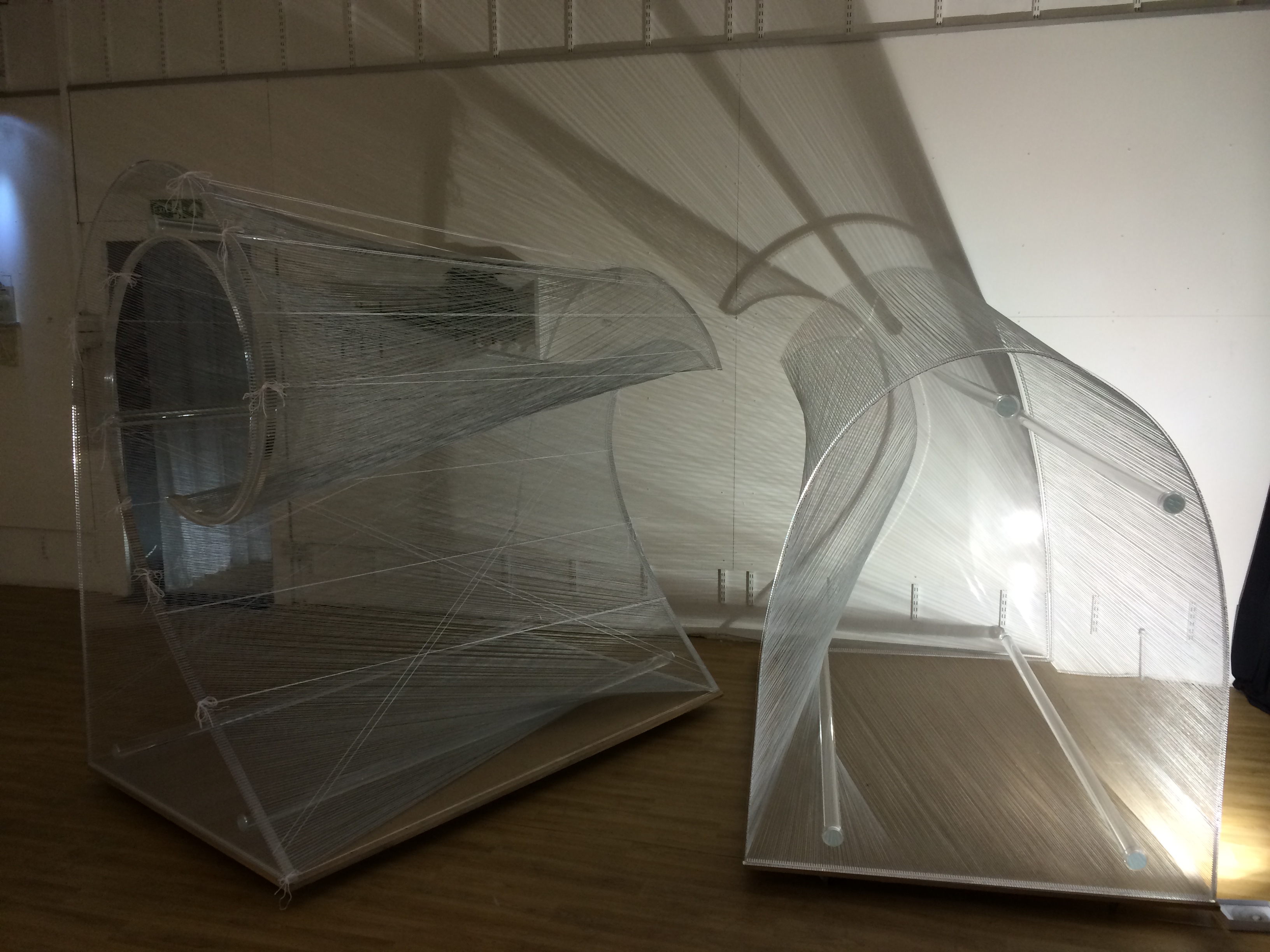 "Modern transparent installations at BAR Gallery for versatile events and exhibitions."