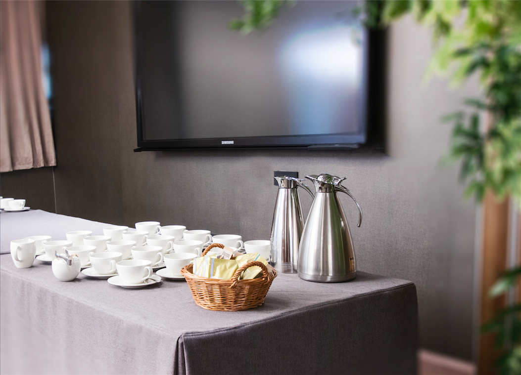 Royal London Suite refreshment station with coffee carafes and pastries for events.