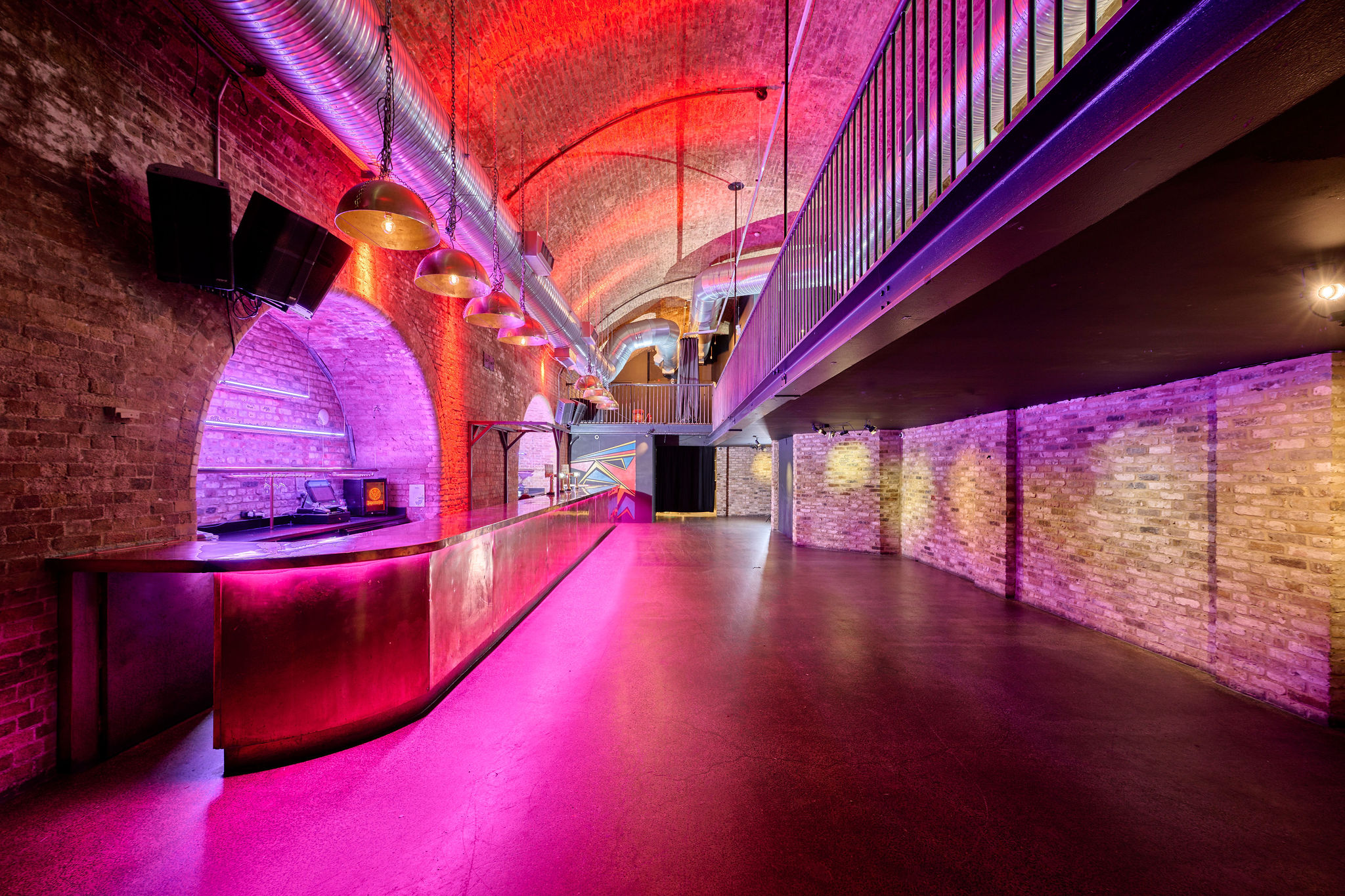 Stylish event space with arched ceiling, ideal for corporate events and private parties.