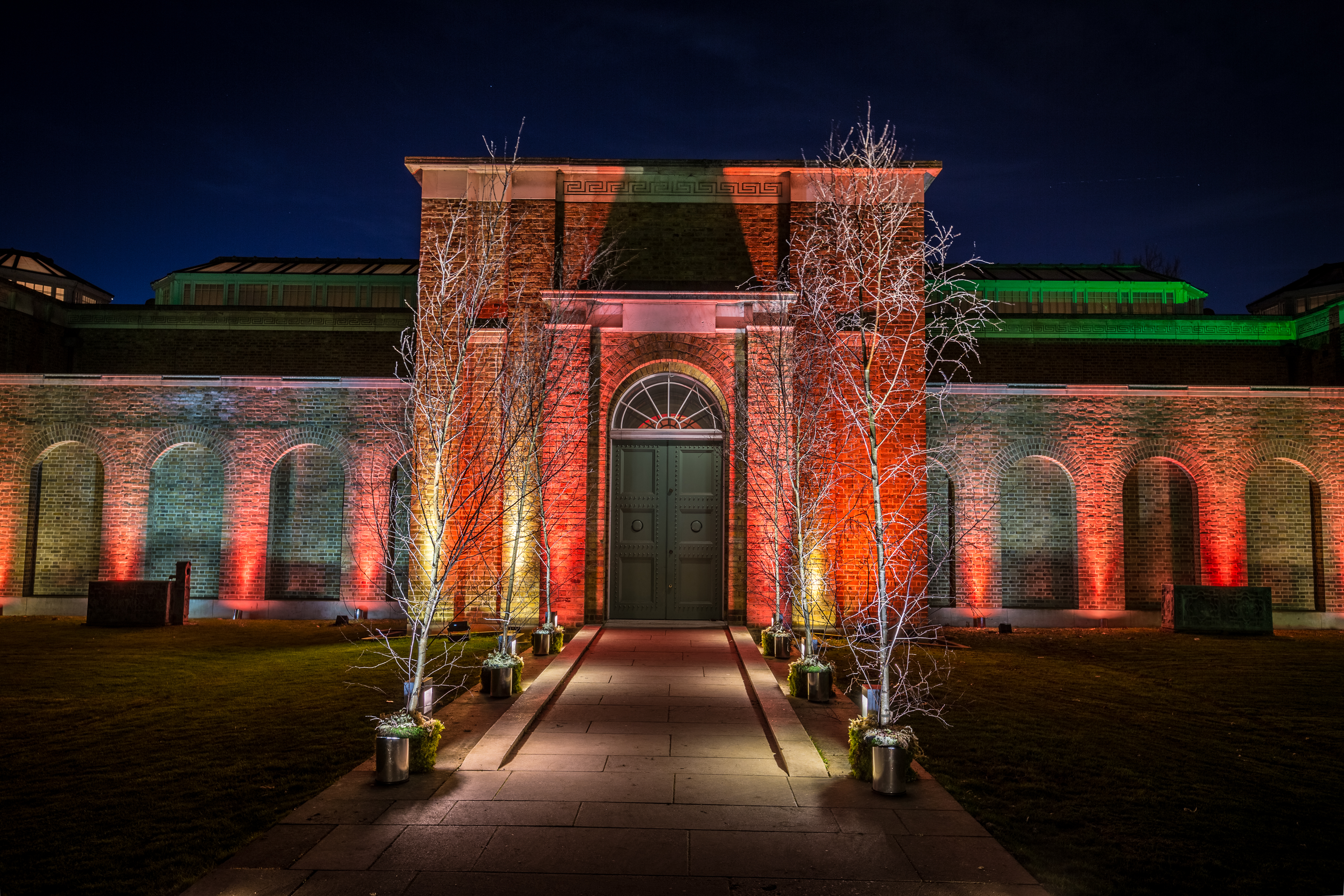 Soane Gallery entrance with vibrant lighting, ideal for elegant evening events.
