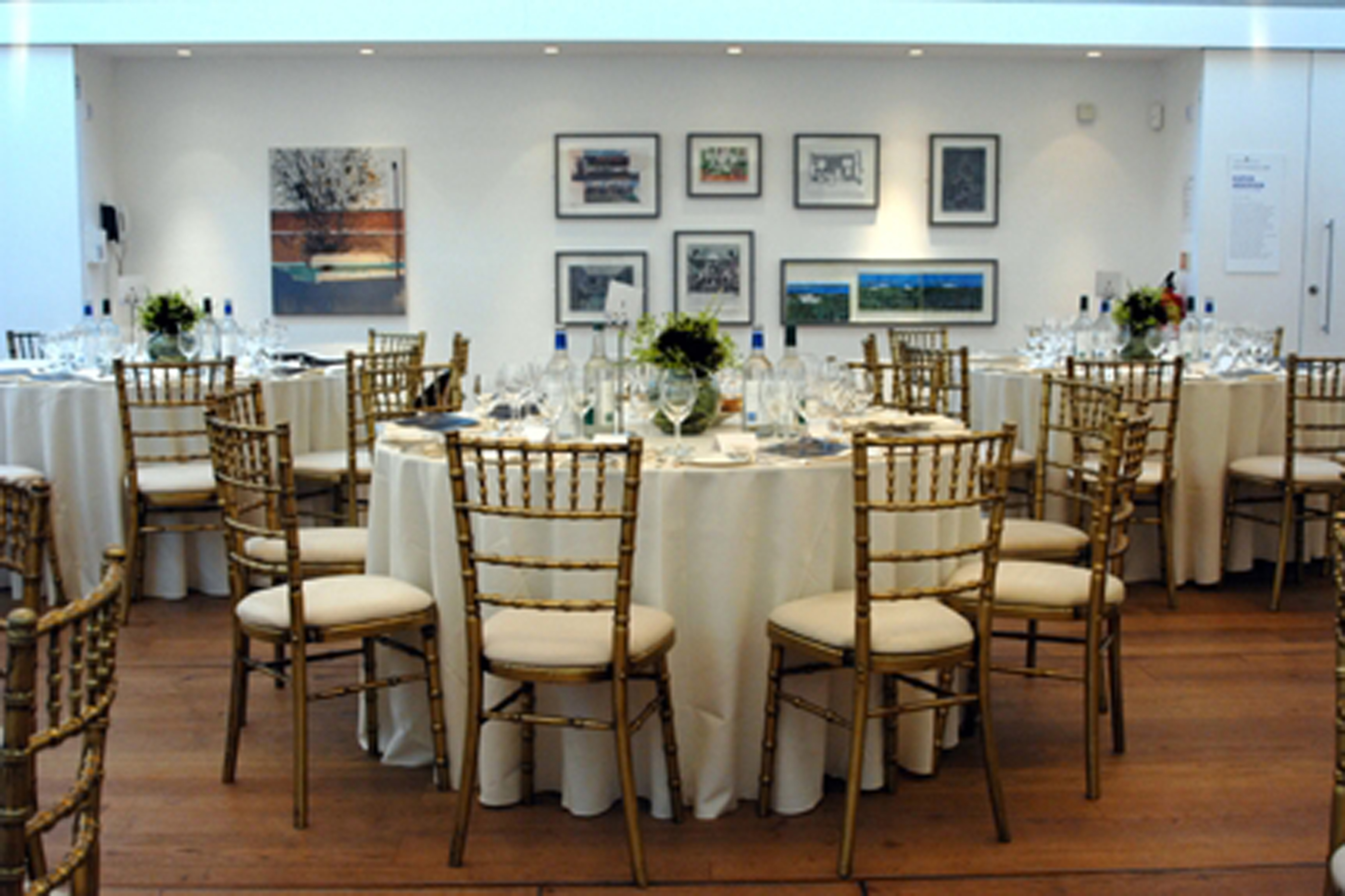 Elegant Linbury Room with round tables, ideal for corporate events and formal gatherings.