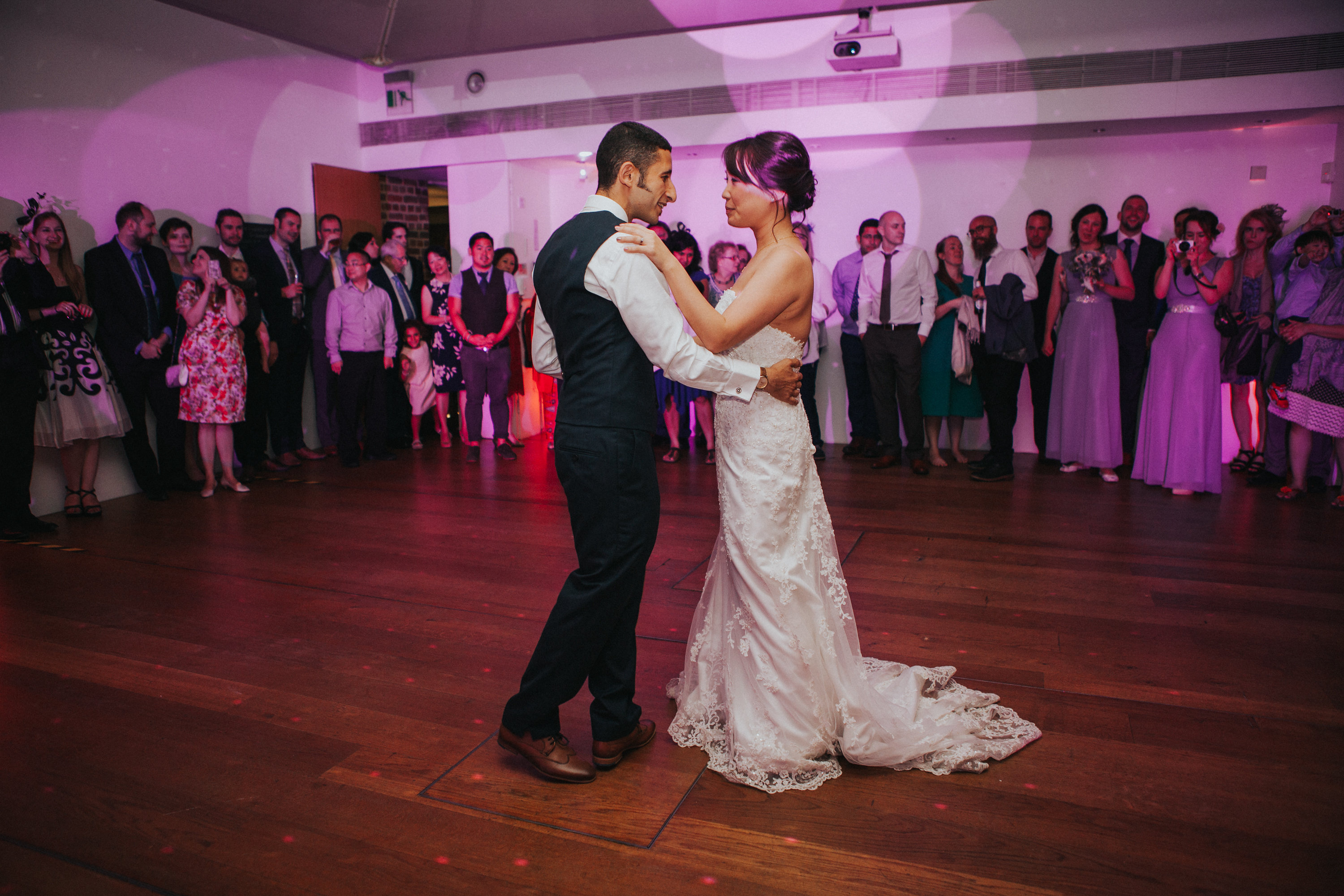 Wedding reception in The Linbury Room, featuring couple's first dance and elegant decor.