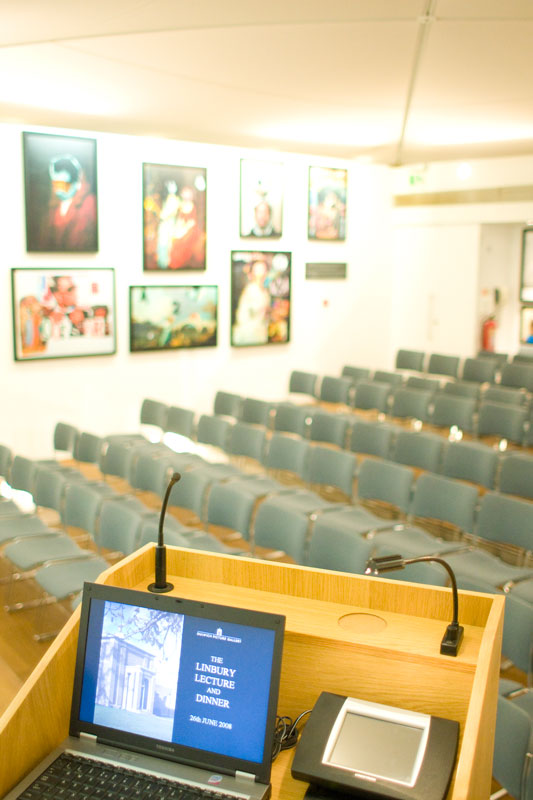 Linbury Room event space with podium and colorful artwork for conferences and meetings.