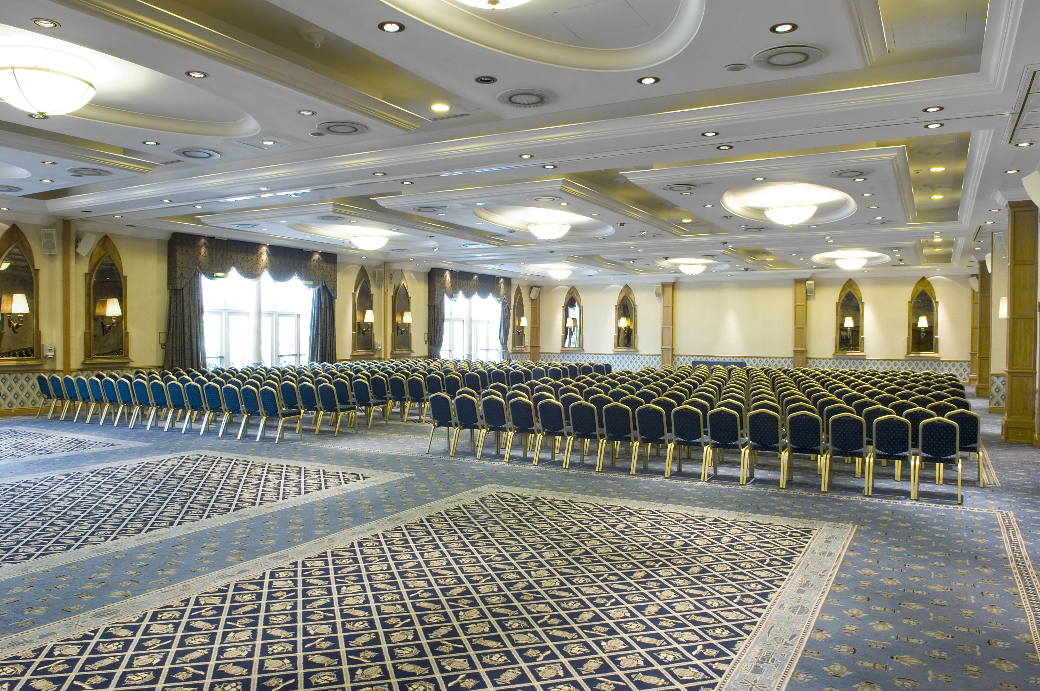 Spacious Alton Towers stateroom for conferences with elegant carpet and high ceilings.