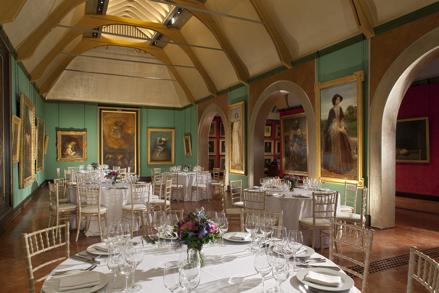 Elegant Watts Gallery event space with fine tableware, perfect for upscale dinners and gatherings.