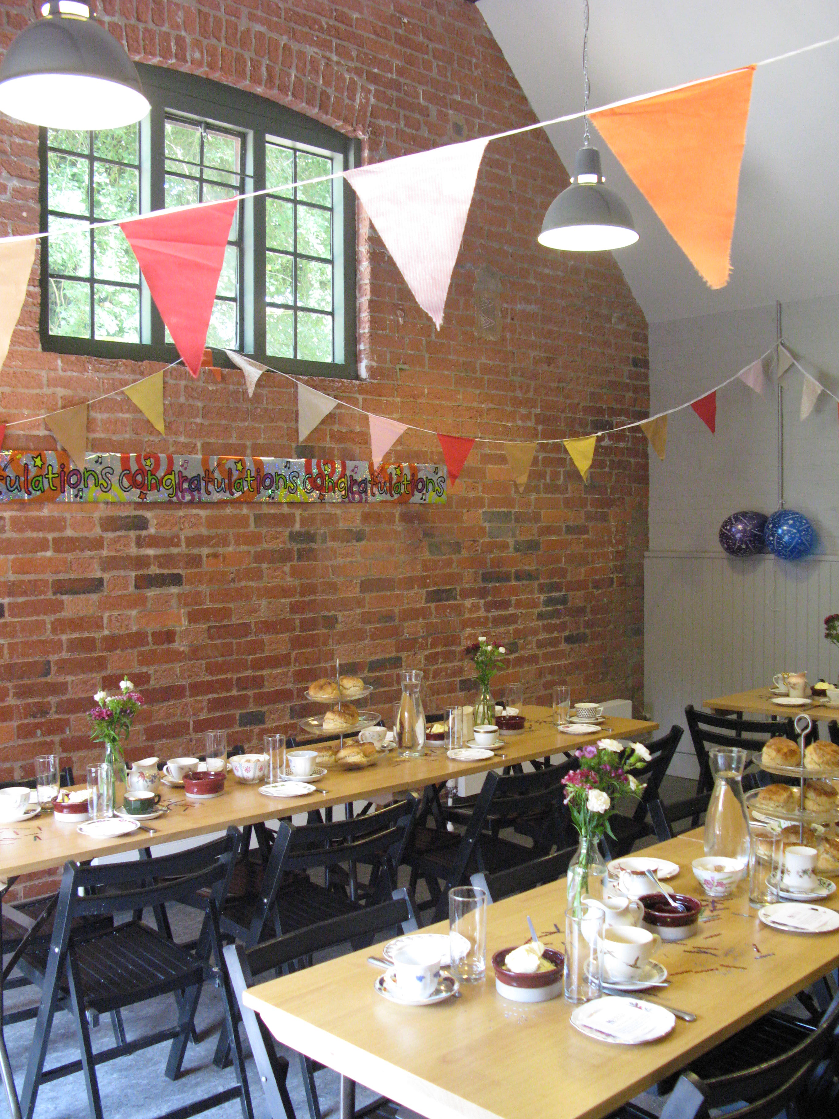 Charming meeting space at The Tea Shop, rustic decor for cozy events and celebrations.