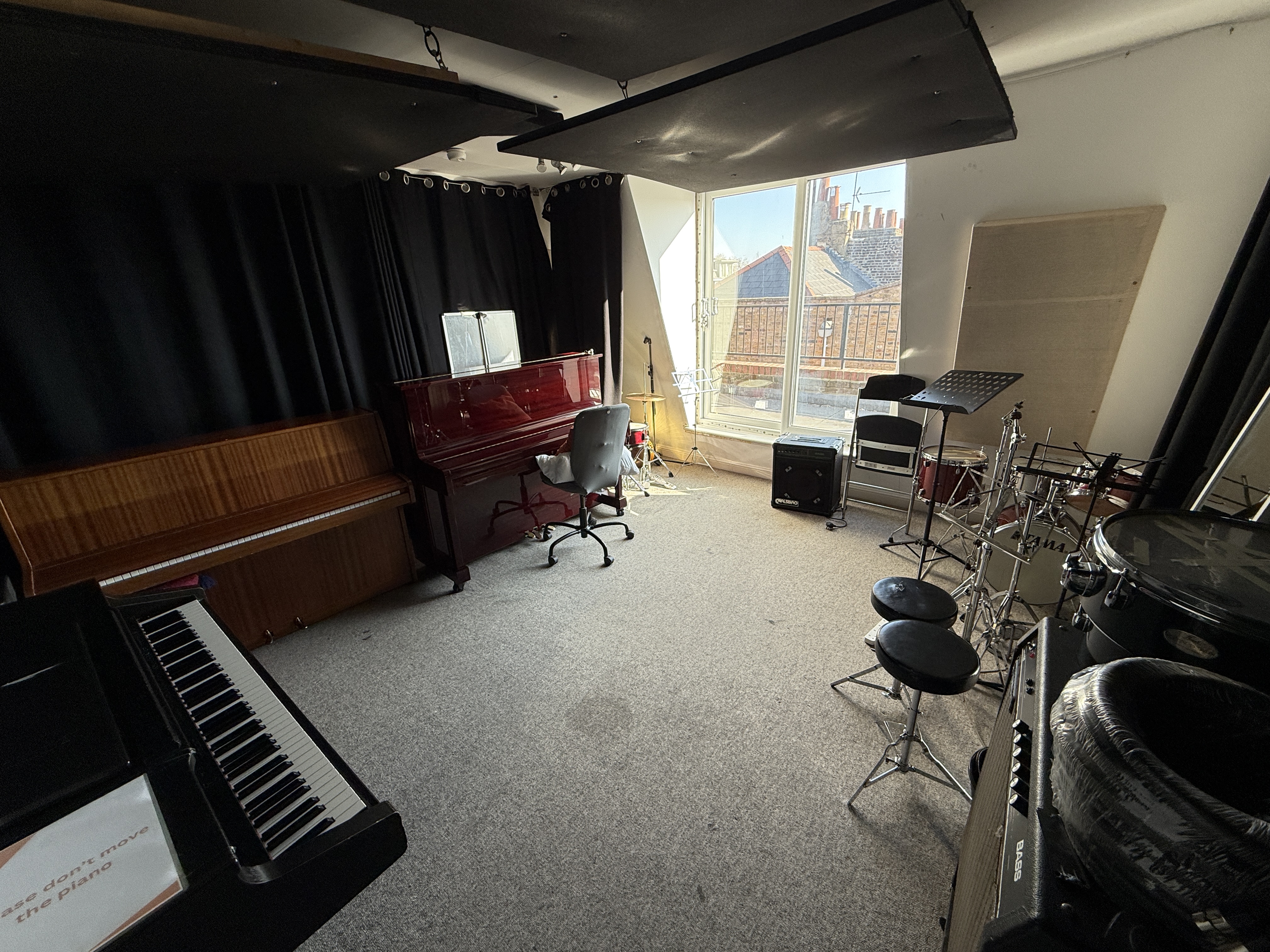 Large Music Room with grand piano, ideal for workshops and events in artsHouse.