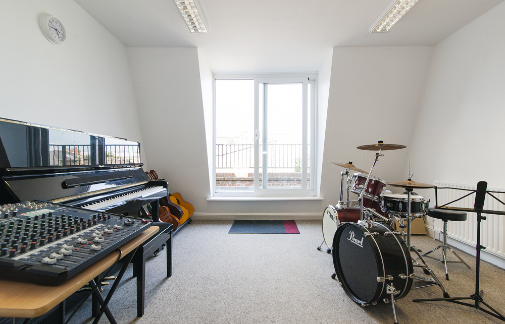 Large Music Room in artsHouse with natural light, perfect for workshops and team-building events.