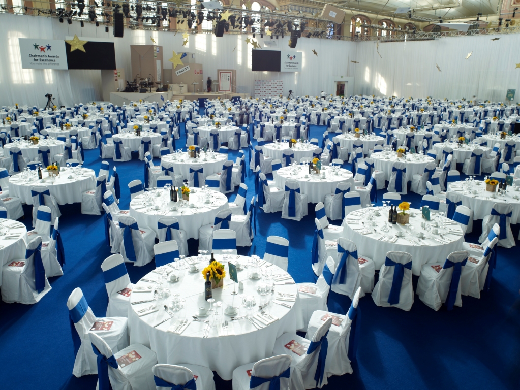 Great Hall at Alexandra Palace set for a formal event with elegant table settings.