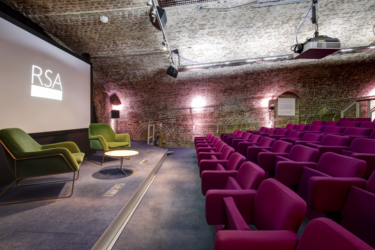 Durham Street Auditorium with purple chairs, ideal for presentations and discussions.