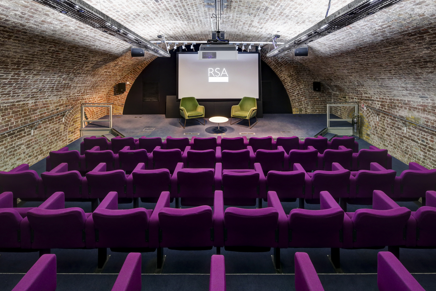 Durham Street Auditorium with purple seating, ideal for conferences and workshops.