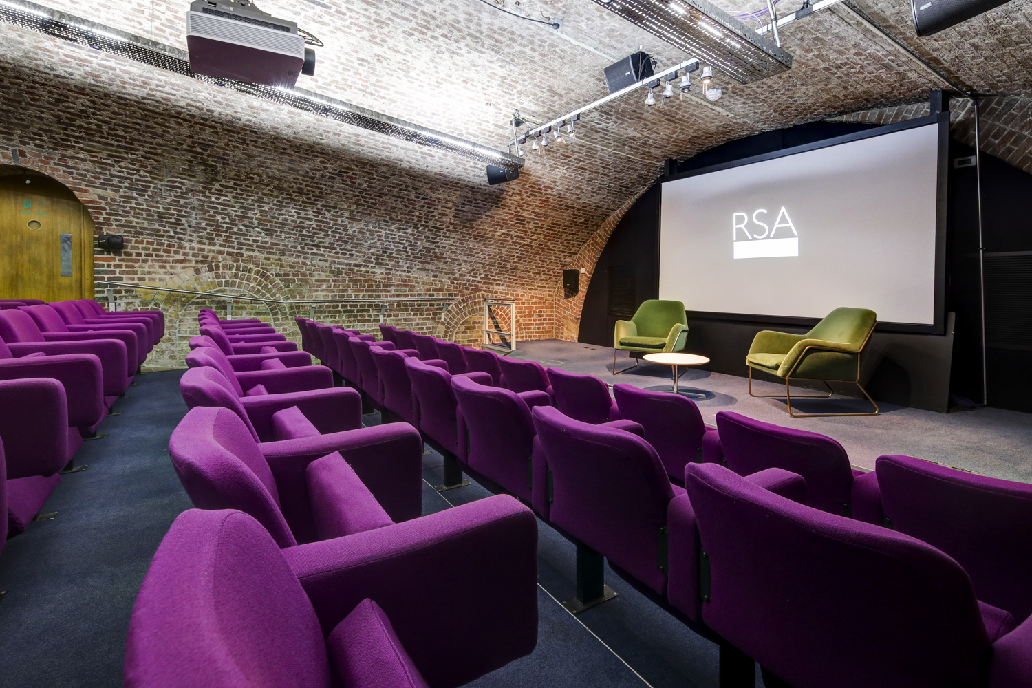 Durham Street Auditorium with plush purple seating, perfect for conferences and workshops.