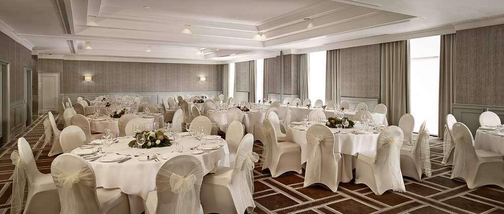 Symphony Ballroom at Hyatt Regency Birmingham, elegant tables set for formal events.
