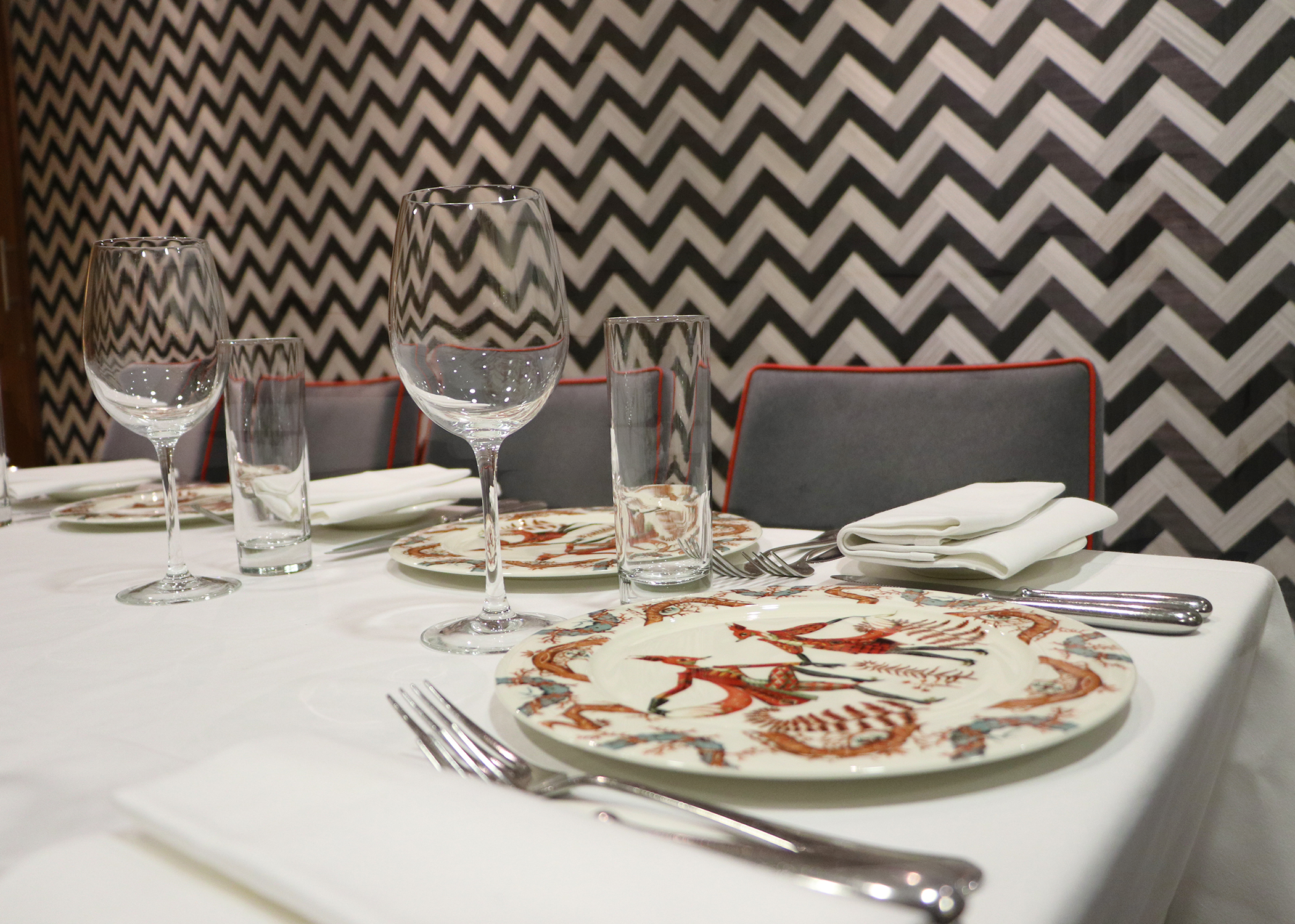 Elegant dining table setup at Opus Restaurant for upscale events and gatherings.