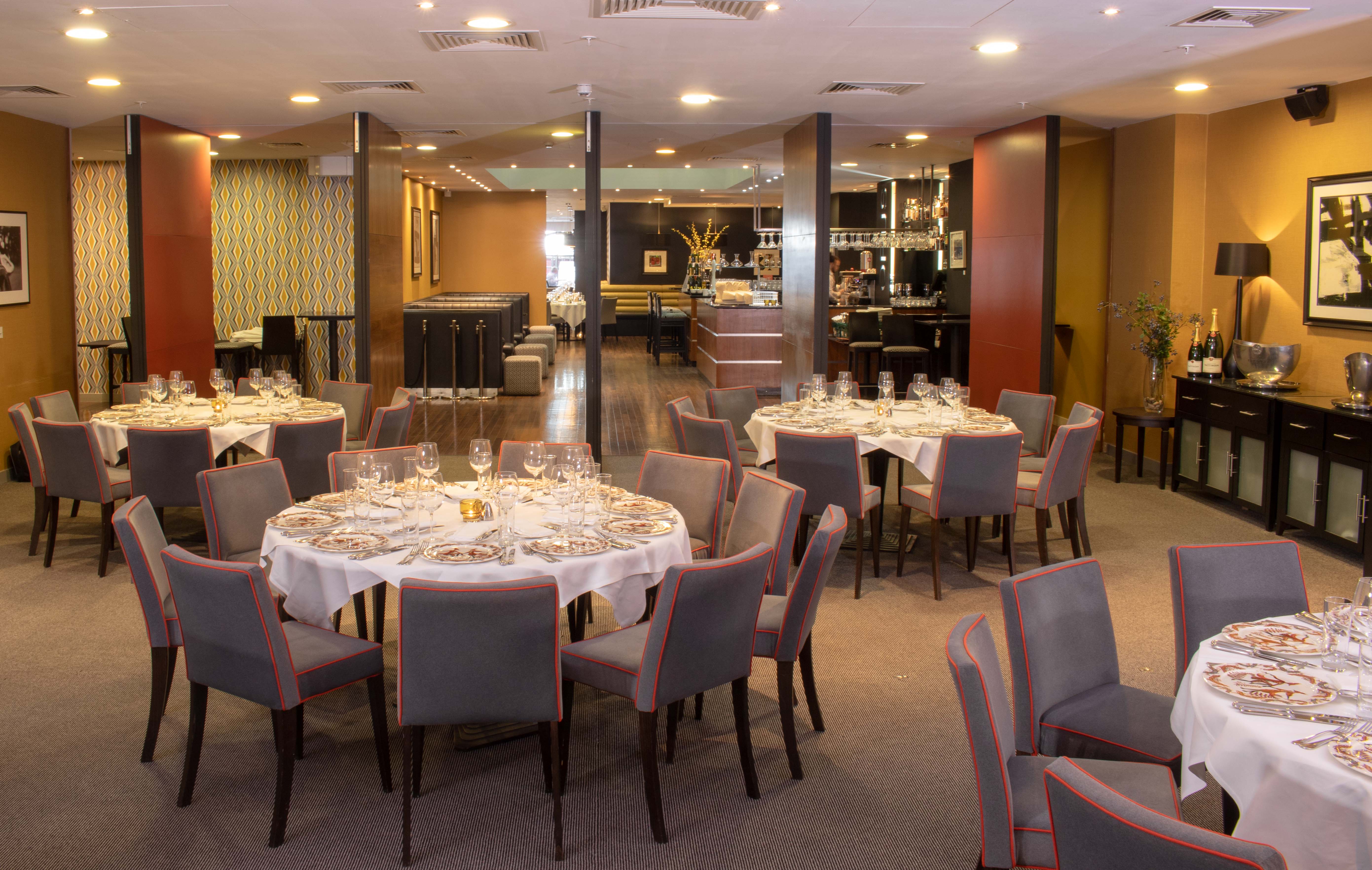 Elegant dining space in Opus Restaurant for corporate events and private gatherings.