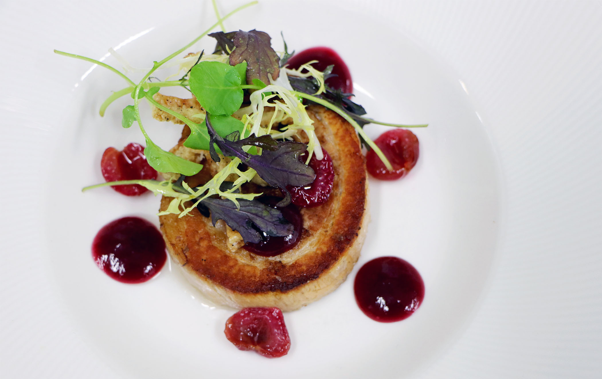 Elegant plated dish at Opus Restaurant, perfect for events and celebrations.