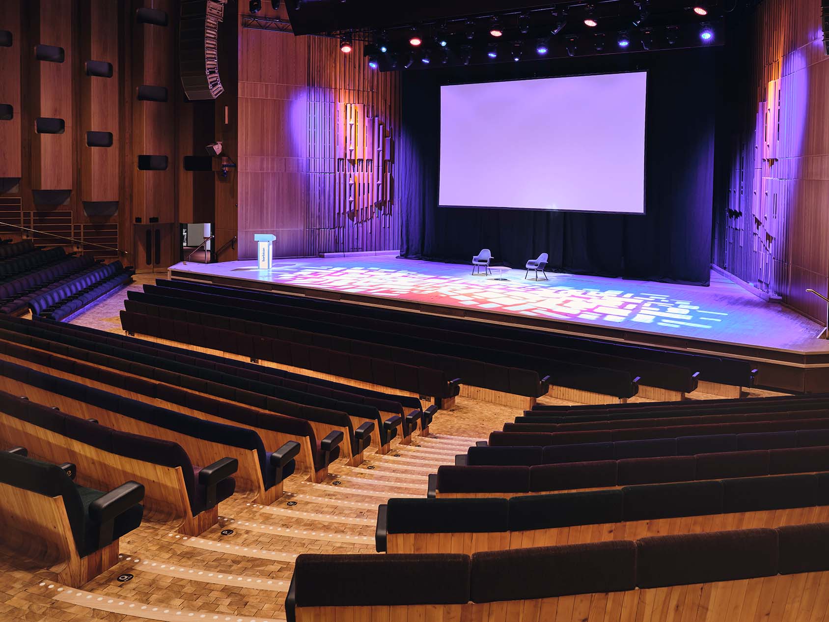 Barbican Hall auditorium with tiered seating, ideal for conferences and presentations.