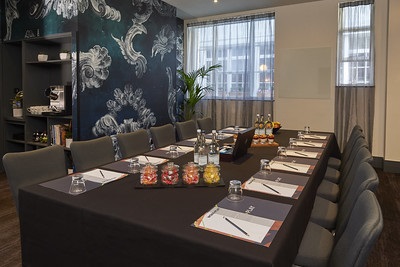 Elegant meeting room in Malmaison London, featuring a striking wall design for corporate events.