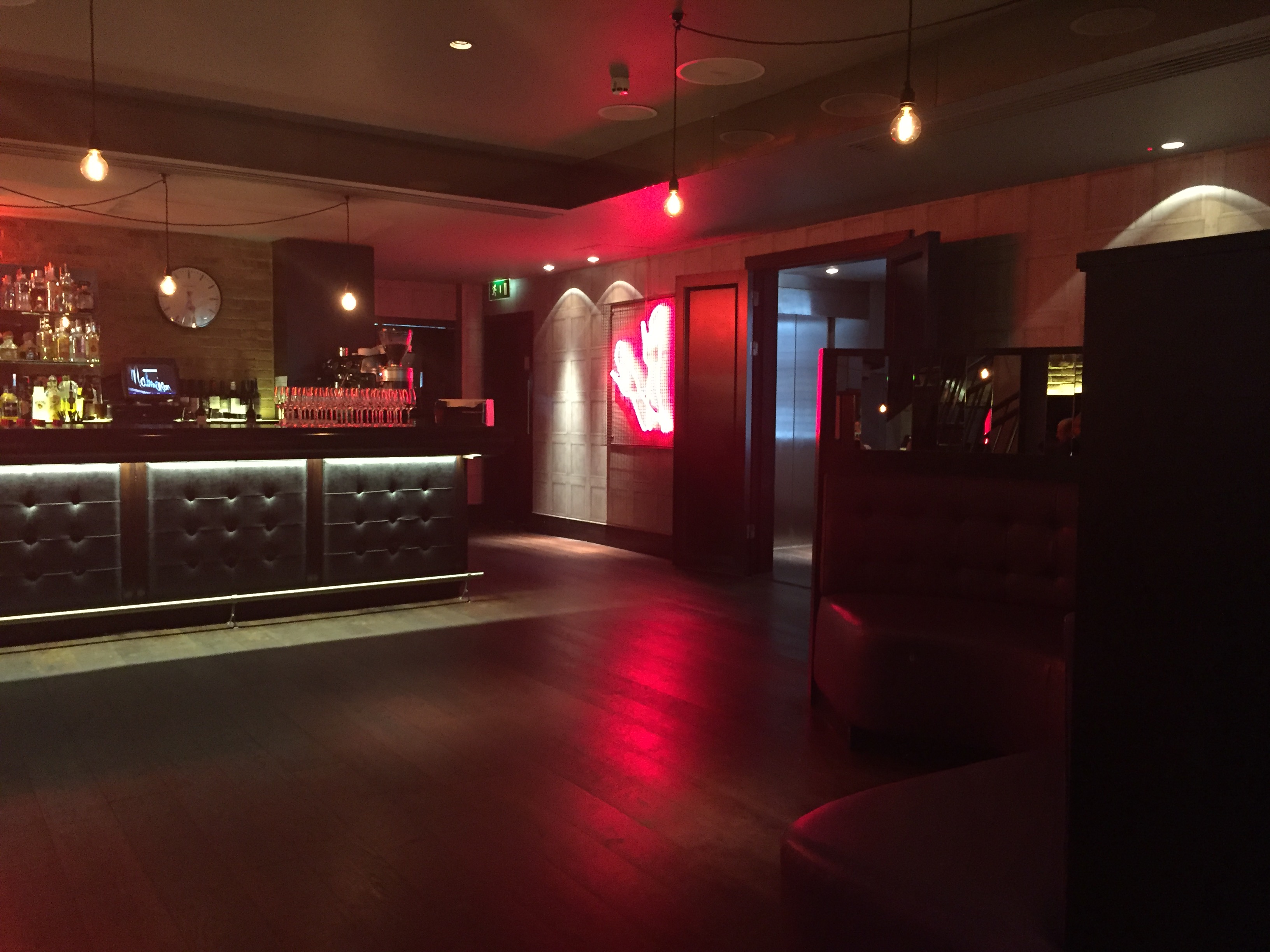 Sophisticated bar at Chez Mal, plush seating for corporate events and gatherings in London.