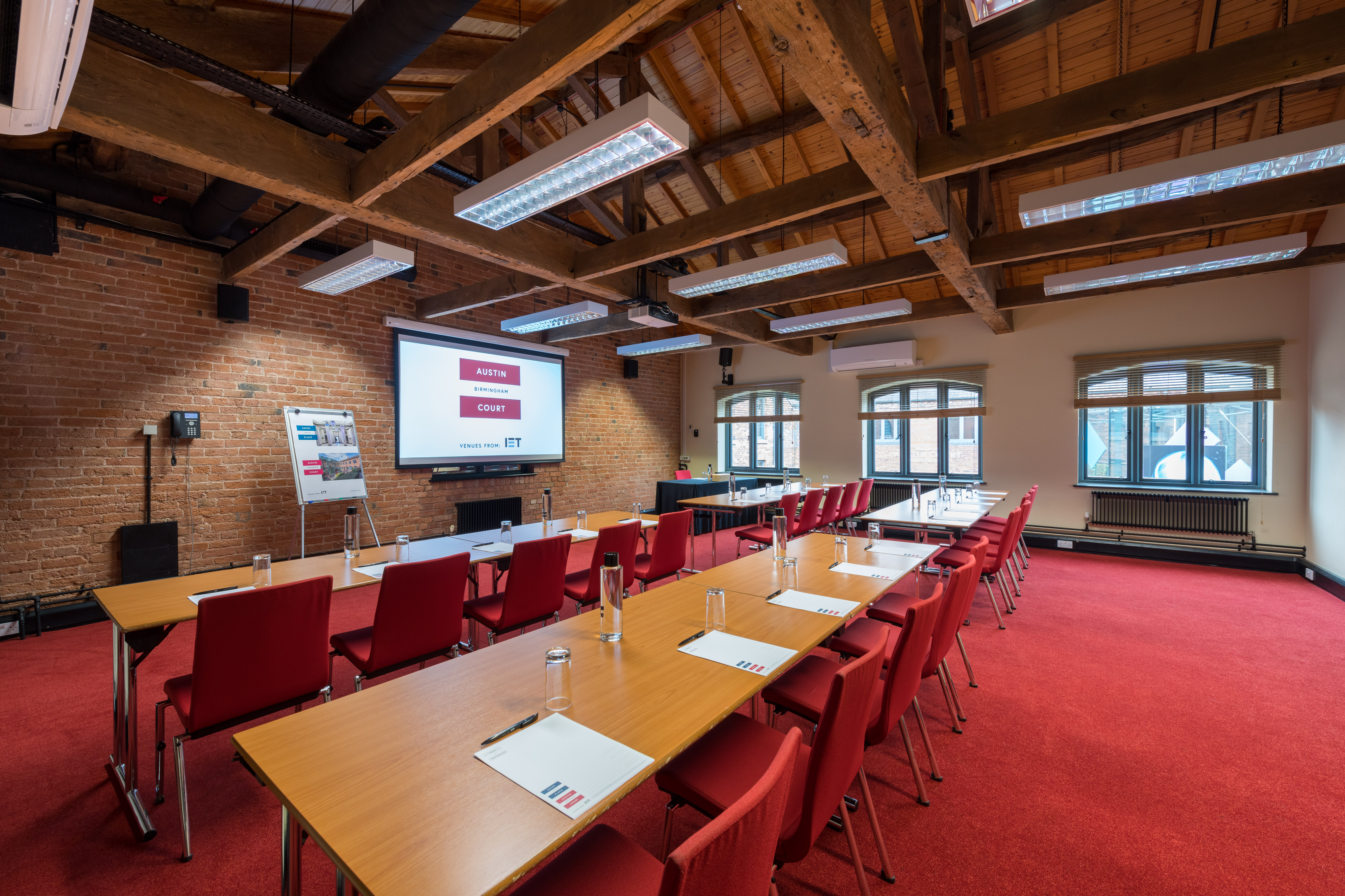 Telford Room at IET Birmingham: Austin Court, featuring wooden beams for corporate meetings.