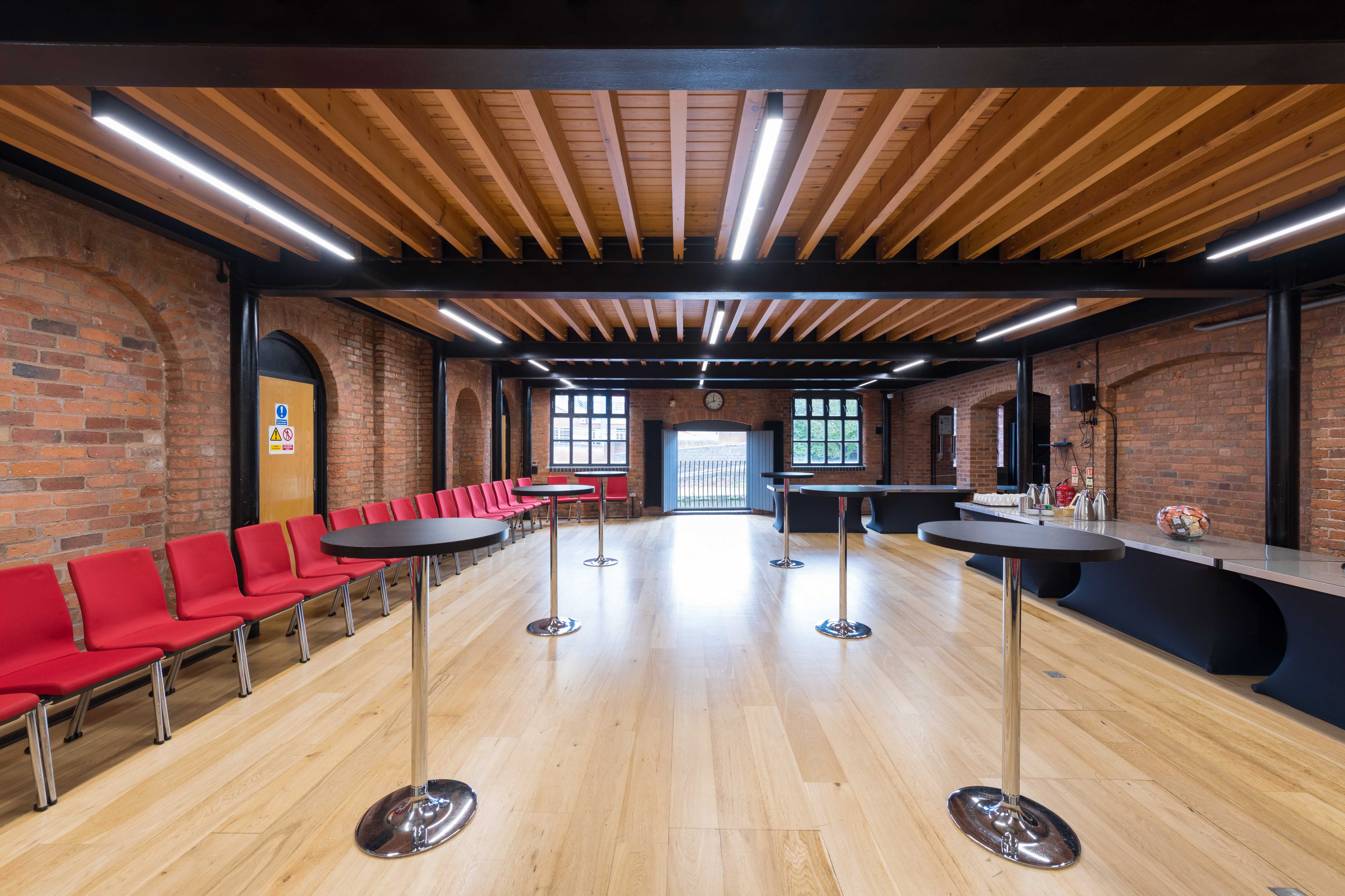 Waterside Room at IET Birmingham: modern event space with exposed brick and natural light.
