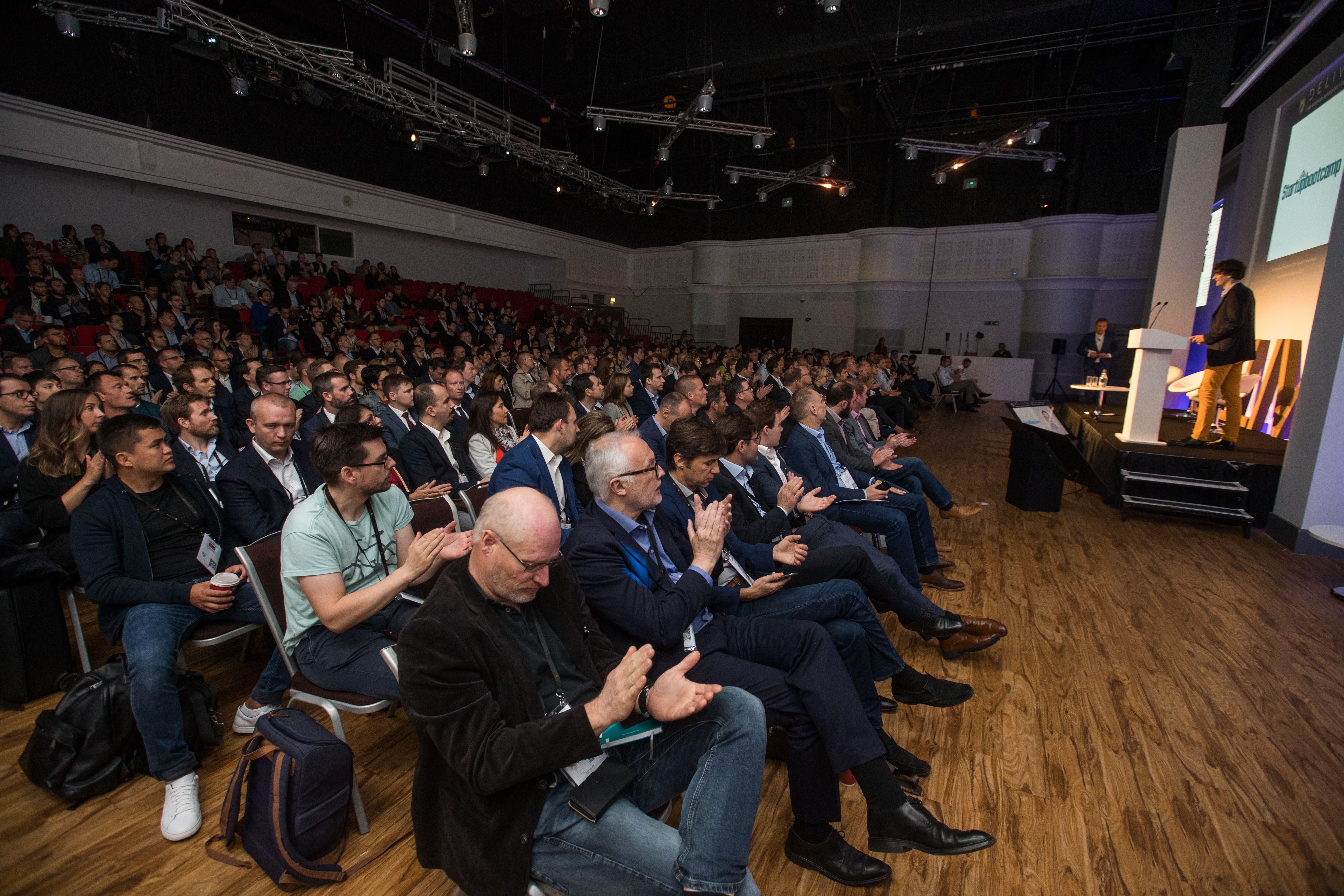 Packed auditorium at Allianz Stadium, Twickenham for a successful event with engaged attendees.