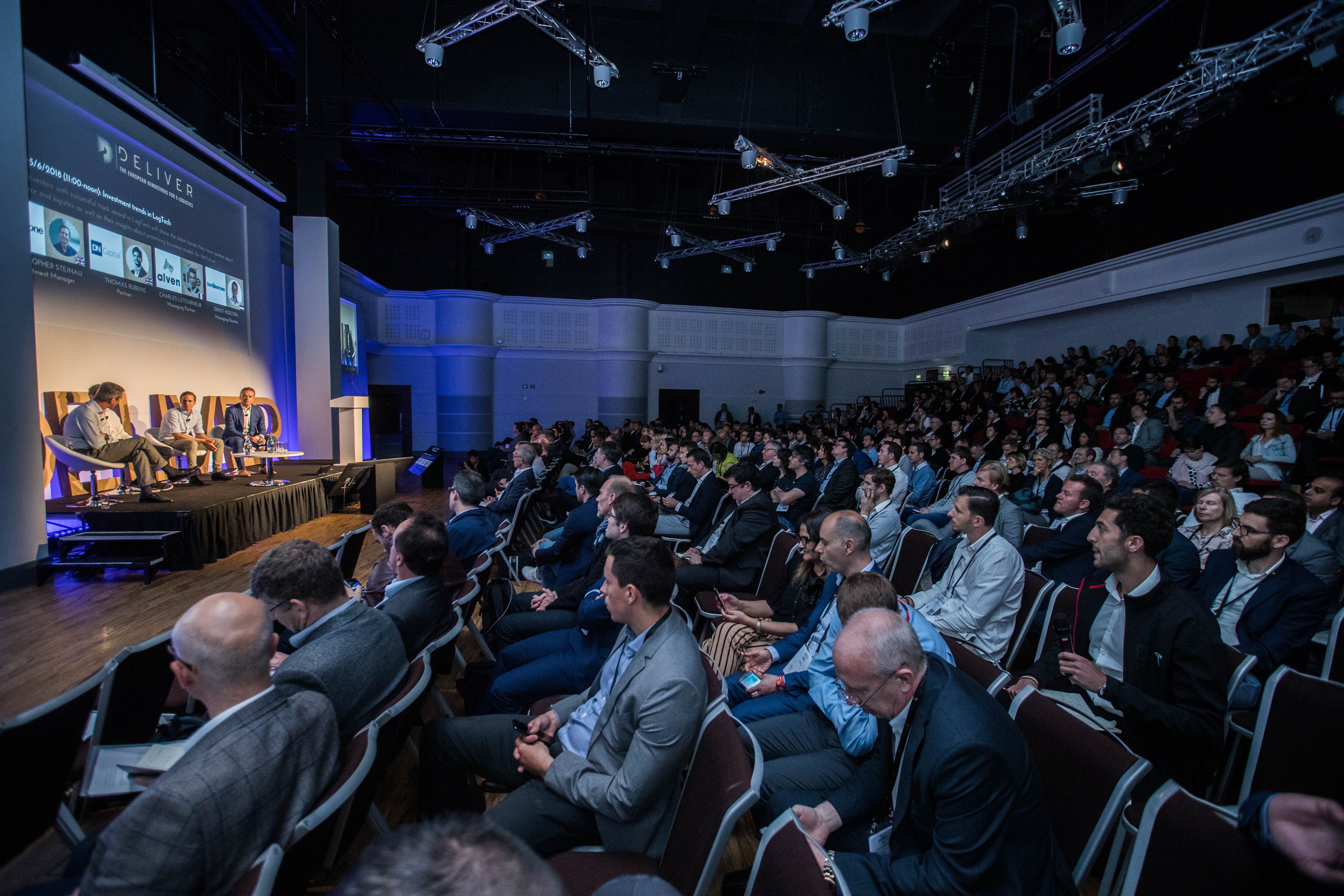 Live Room at Allianz Stadium, Twickenham: engaged audience at a conference panel discussion.