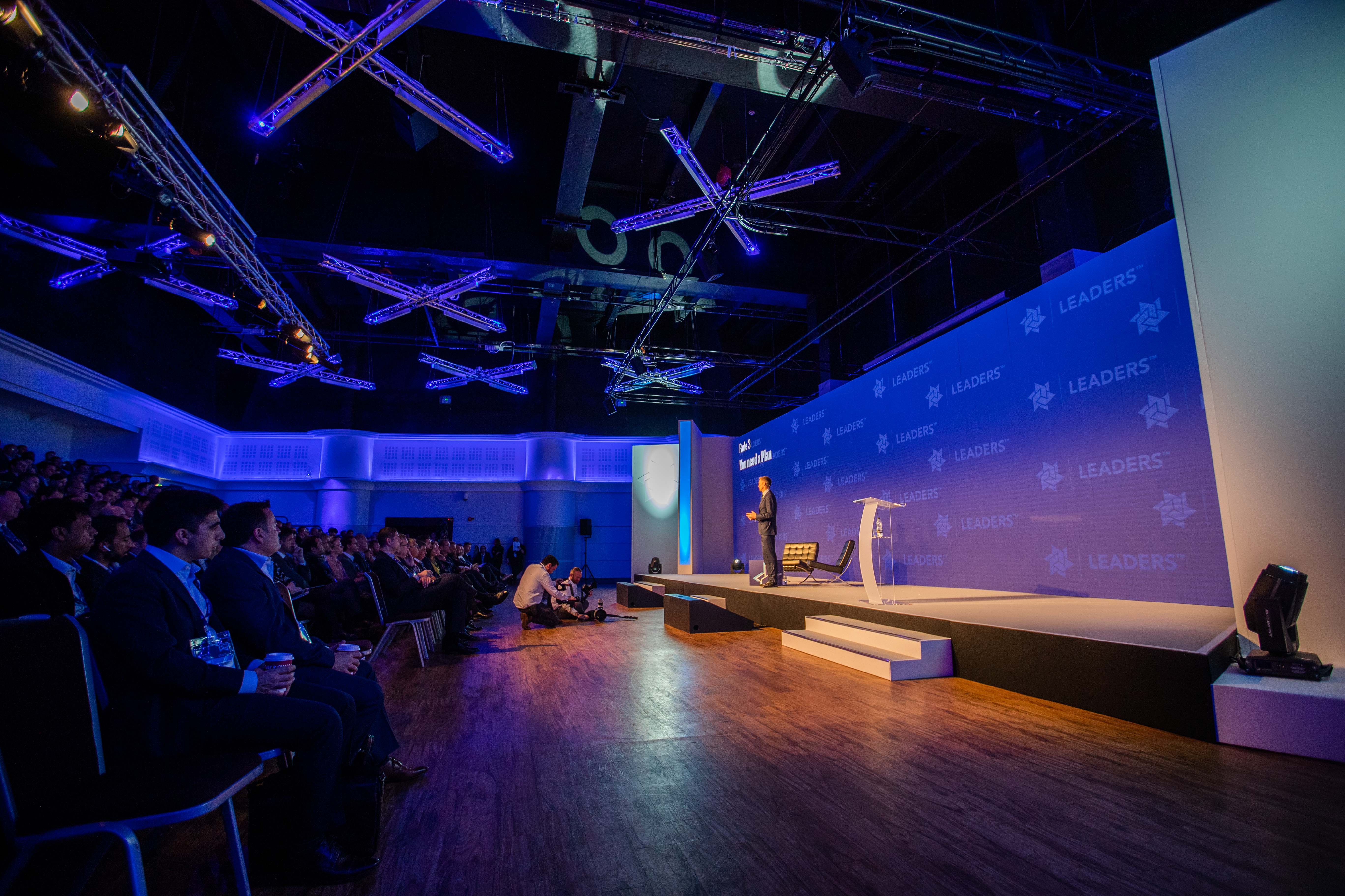 Live Room at Allianz Stadium, Twickenham: conference setting with speaker and engaged audience.