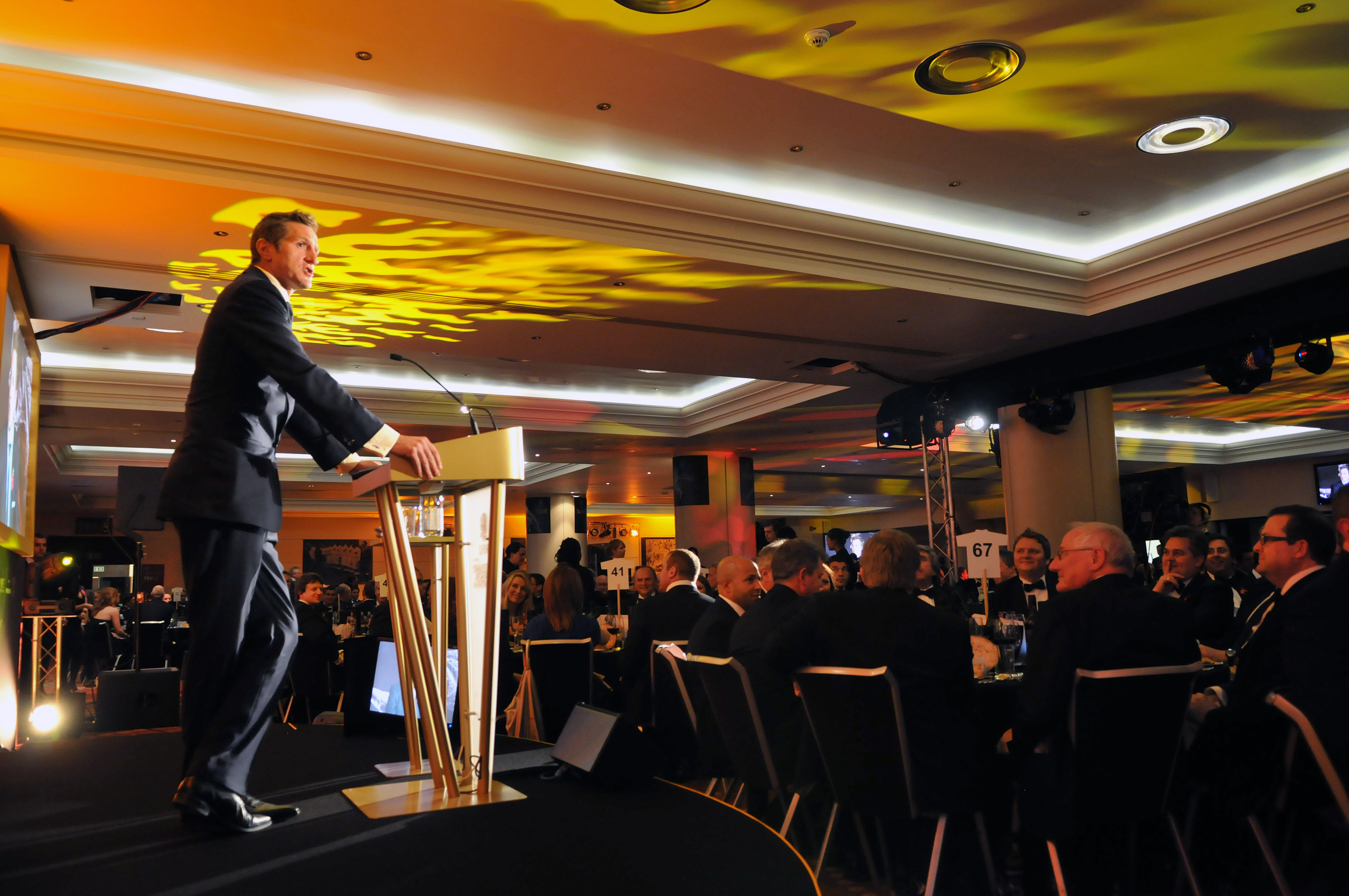 Corporate event in Rose Suite, Allianz Stadium with speaker and attentive audience.