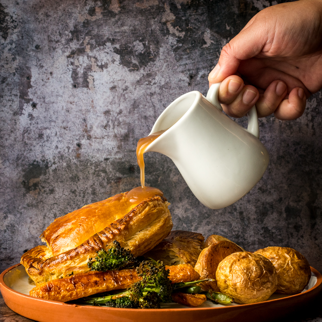 Christmas cooking experience with golden pastry drizzled in rich gravy at Jenius Social.