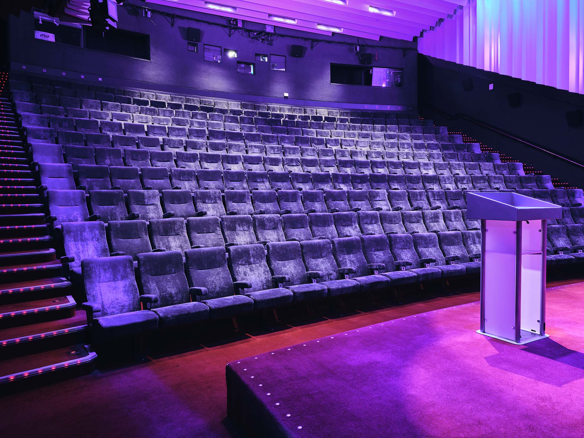 Cinema 1 auditorium at Barbican Centre with tiered seating for presentations and speeches.
