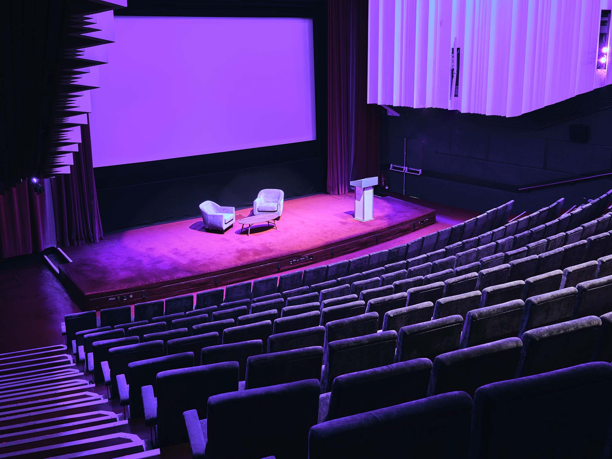 "Cinema 1 at Barbican Centre: vibrant purple stage for presentations and panel discussions."