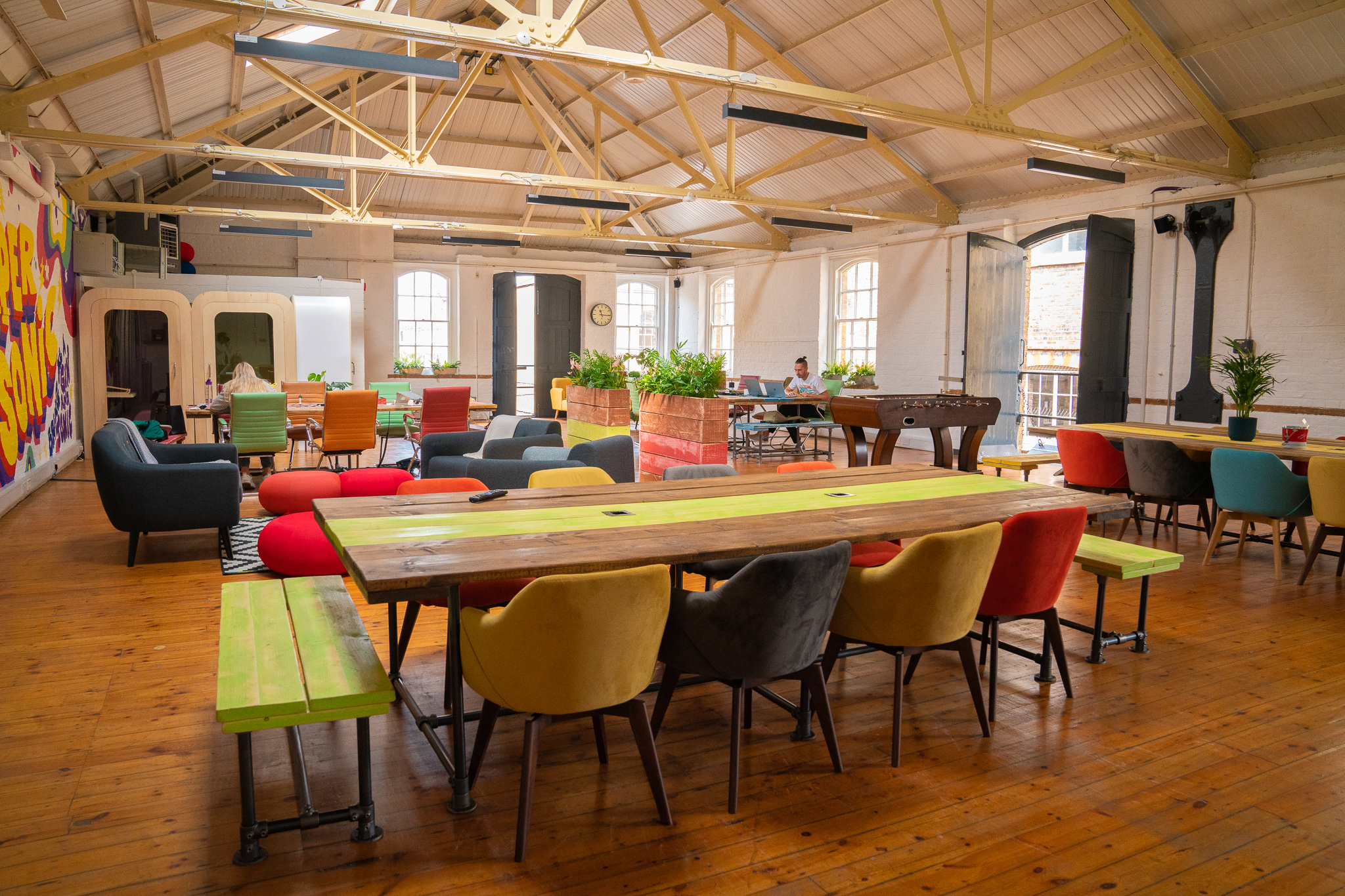 Vibrant meeting space with colorful seating for creative brainstorming sessions.