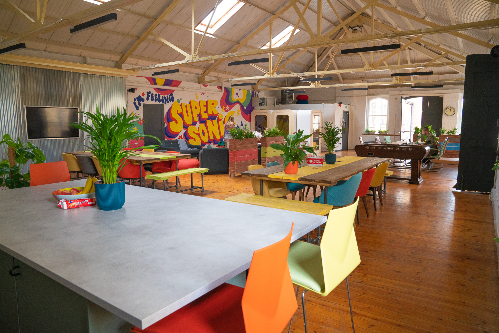 Vibrant event space with colorful furniture for creative meetings and workshops.