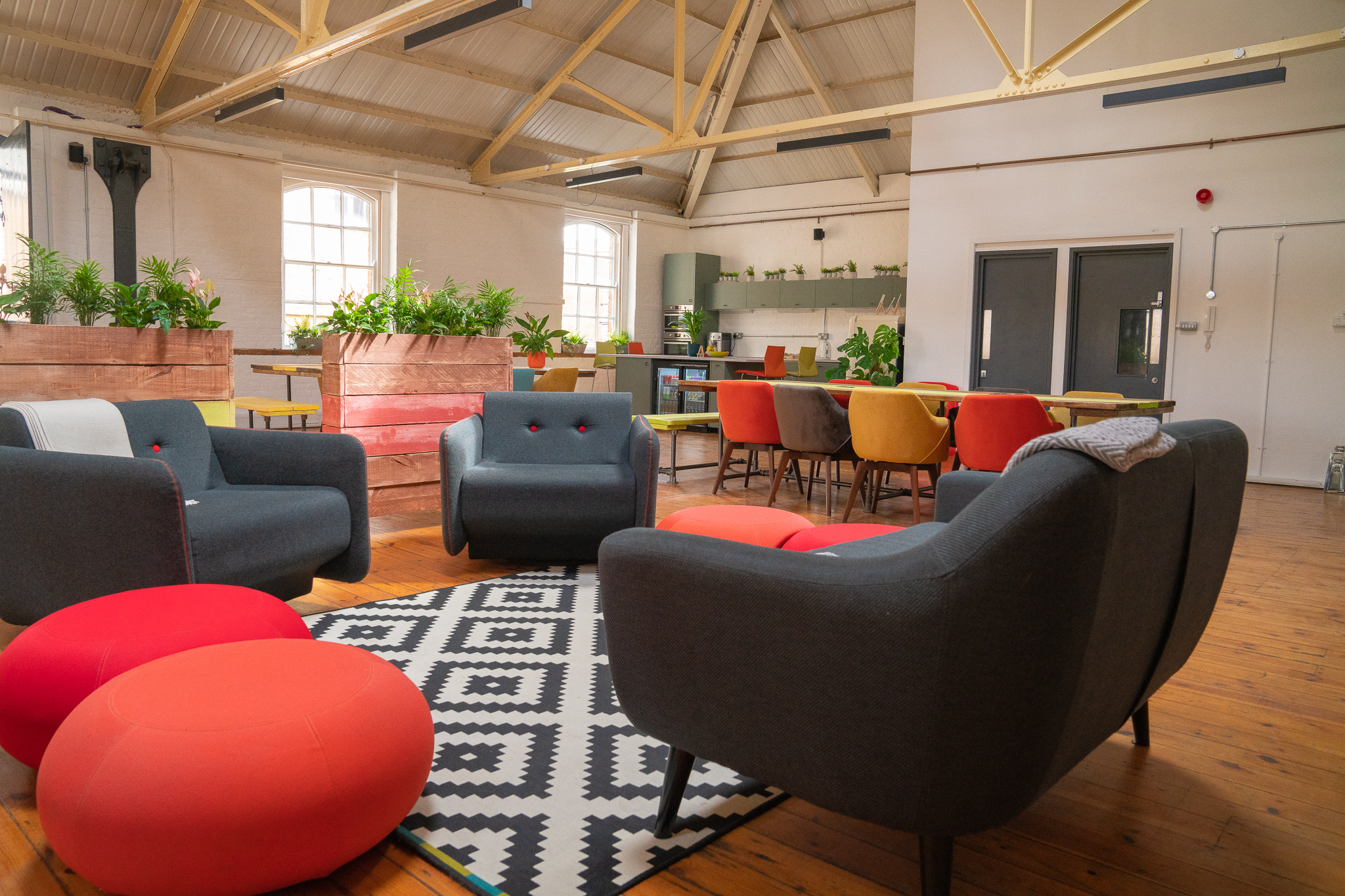 Vibrant meeting space with colorful seating for creative brainstorming sessions.