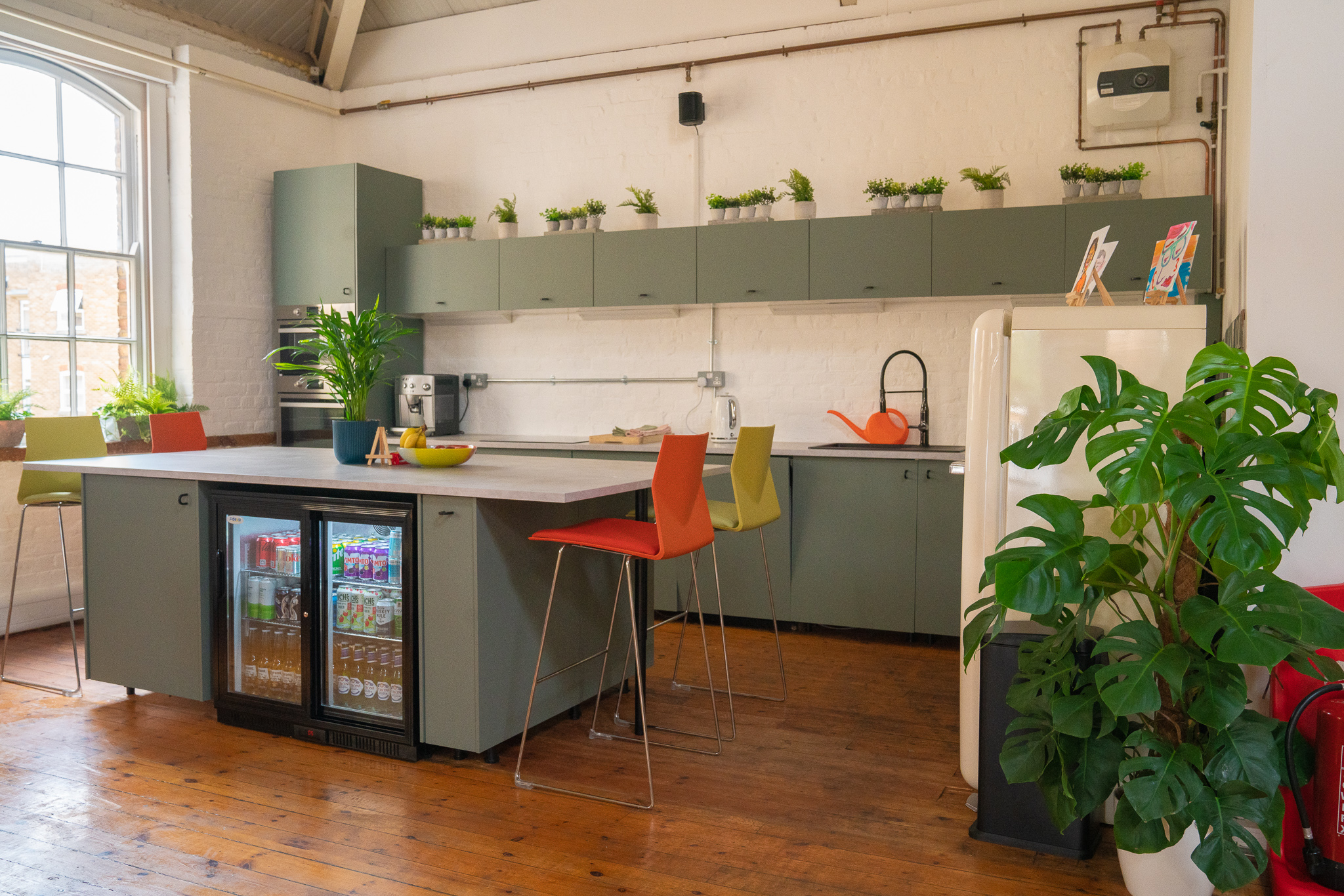 Modern kitchen in The Loft, perfect for catering events with sleek design and greenery.