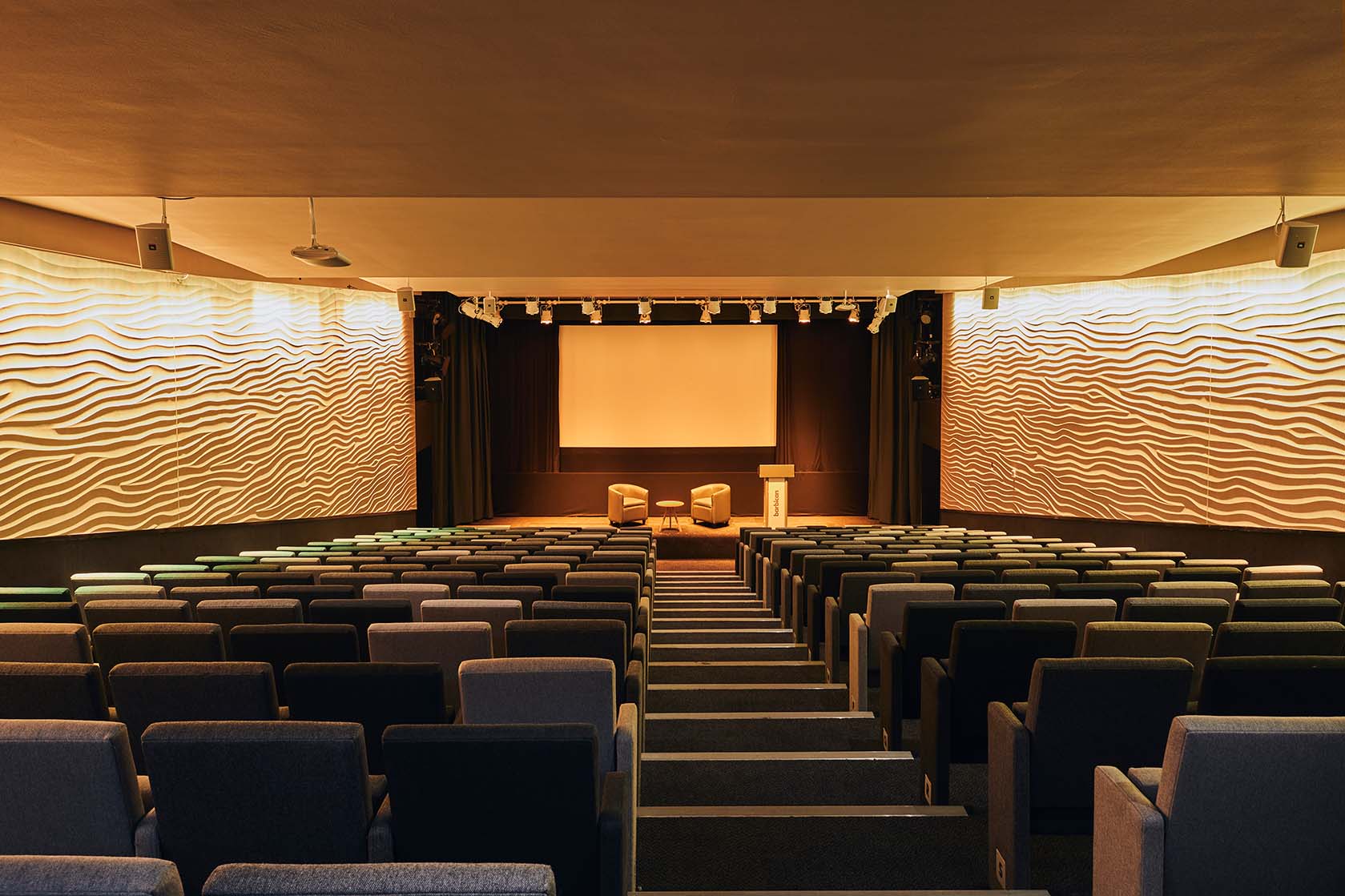 Modern Frobisher Auditorium 1 with tiered seating for conferences and workshops.