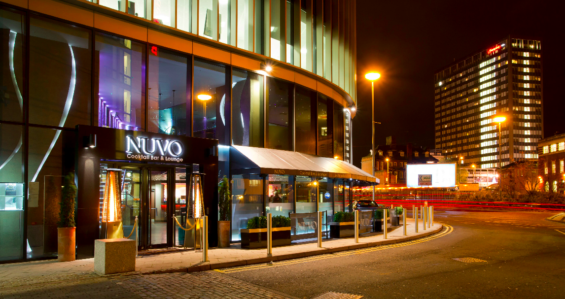 Modern cocktail lounge NUVO at night, perfect for upscale events and networking.