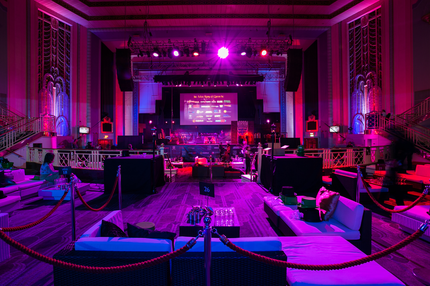"Stylish lounge seating at Troxy Christmas party with dynamic lighting for festive gatherings."