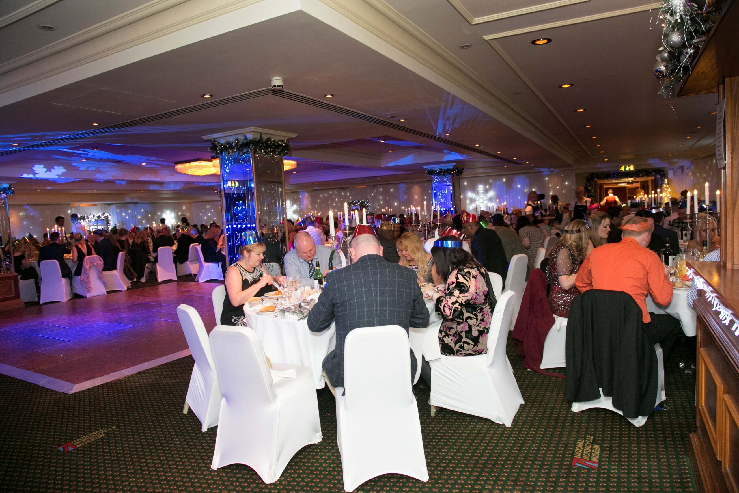 Elegant event at The Bracebridge, featuring round tables and festive decor for gatherings.