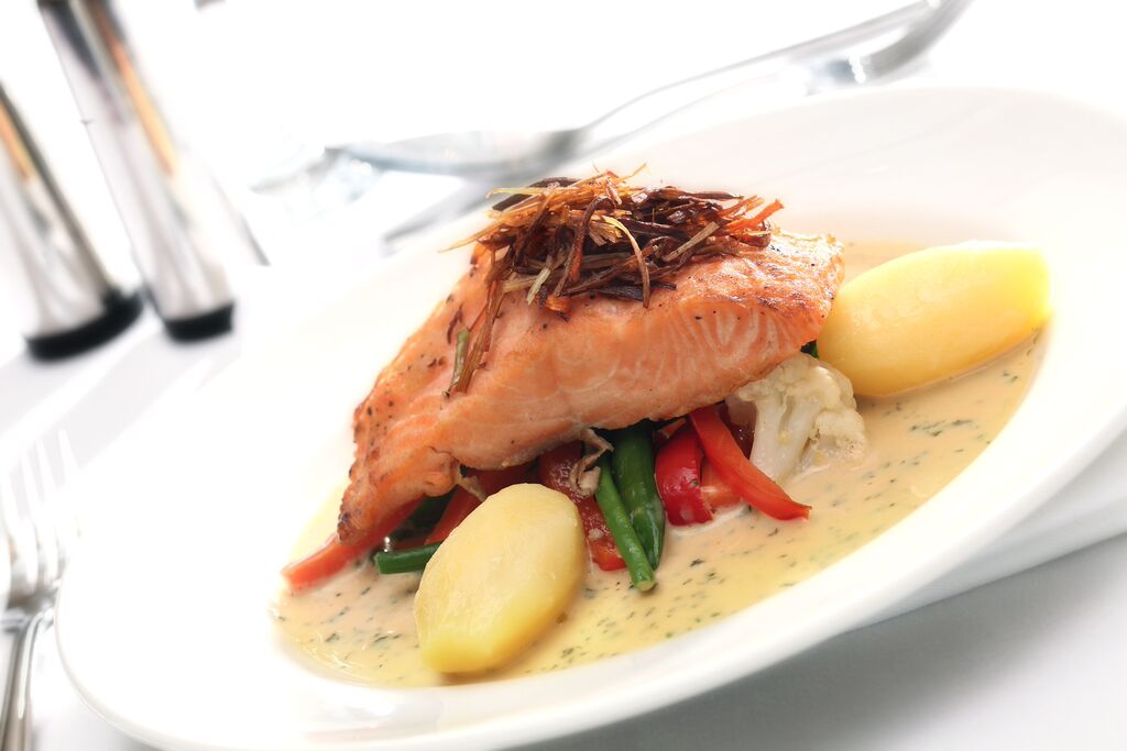 Plated salmon dish at The Bracebridge, showcasing event catering and culinary presentation.