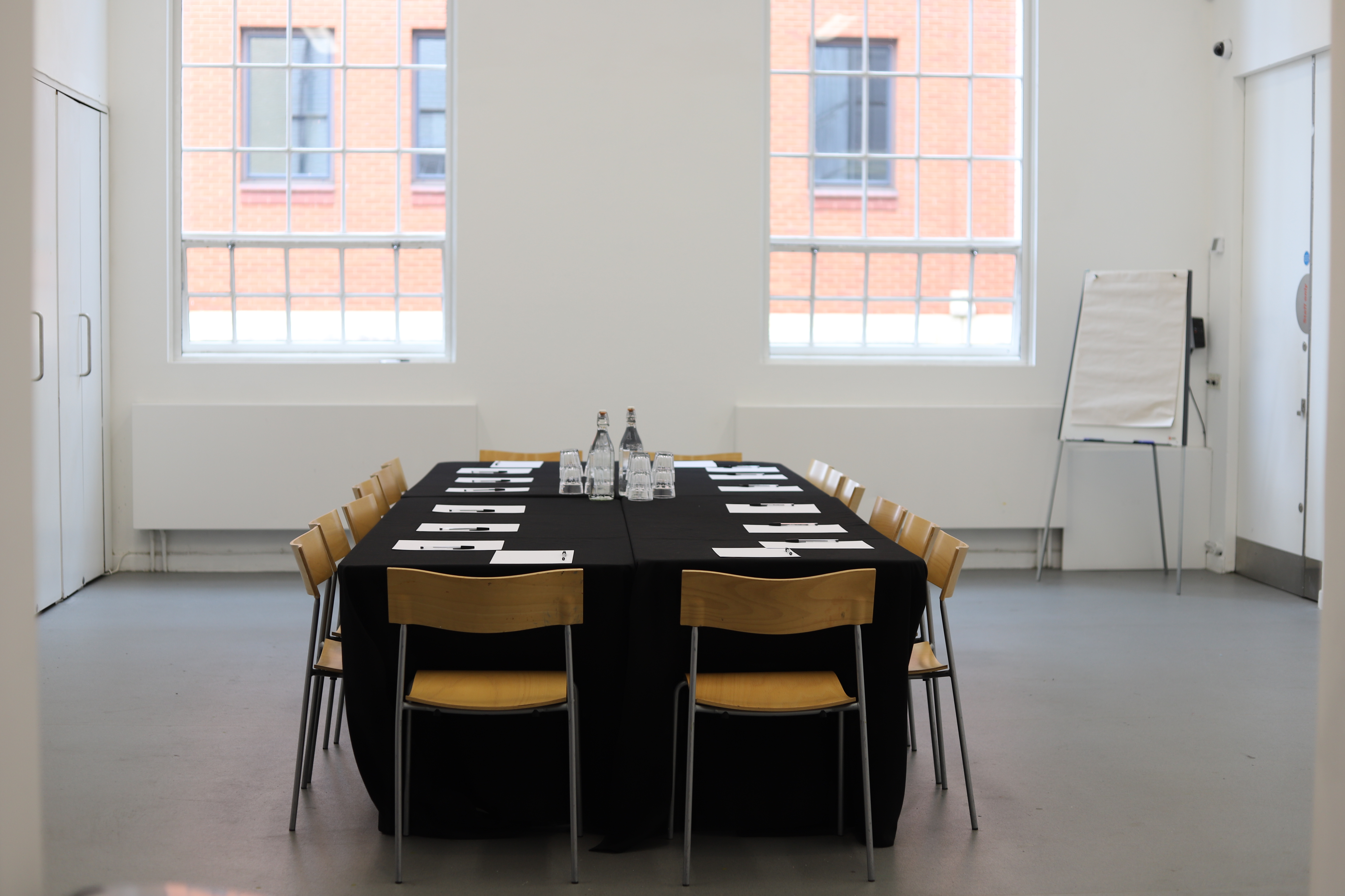 Events Room at Ikon Gallery with black linen table, ideal for meetings and workshops.